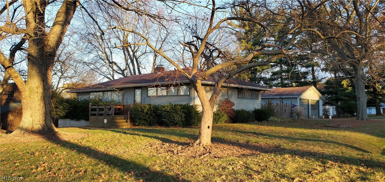 Welcome to a classic mid century 3 bedroom 2 bath ranch on a 3/4 acre lot. The open floor plan lends itself to comfortable lifestyle living. The living room with fireplace has large windows that bring in light and views of farm land. The ample sized adjacent kitchen and formal dining area are perfect for family gatherings. The full walkout basement has a workshop and 377 square foot partially finished recreation room that can add additional living space. The exterior deck that is perfect for warm weather entertaining, leads to an oversized detached garage. For additional storage there is a shed that can accommodate lawn equipment too.
The home needs some updating, but has tons of potential and the convenience of first floor living. This home is being sold as is.