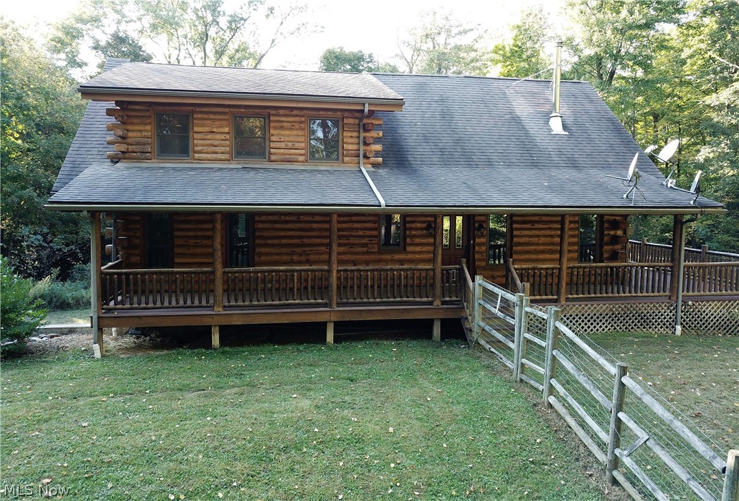 Ever dreamed of living where the blacktop ends? Your dreams can now become a reality! This one owner log home sits on 7.66 secluded acres surrounded by an abundace of nature. This home features amazing views from its wrap-around porch as well as its screened-in three-season room with stunning stone fireplace. This property has a fenced-in yard so even the family pets can enjoy the great outdoors. On the main floor, there is an open floor plan with vaulted ceilings and floor to ceiling windows to enjoy all the natural light that surrounds you. The living room is complete with a fireplace to keep you warm on those cold winter nights. The kitchen features updated appliances and an island with a butcher block top. The main floor is complete with 2 bedrooms a full bath and laundry area. Upstairs you are greeted with an open loft. This space is perfect for an office with spectacular views overlooking the lower level. The owner's suite features an enormous room, walk-in closet and a bathroom