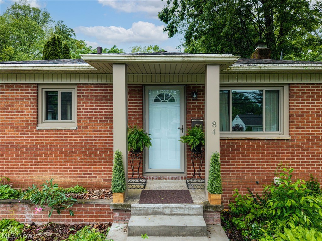 This tastefully updated 3-bedroom, 2-bath all-brick ranch beautifully blends comfort, style, and functionality. From the moment you arrive, the home’s inviting curb appeal sets the tone, featuring recently installed taupe vinyl windows that perfectly complement the brick exterior, attractive taupe porch columns, and new concrete steps that create a welcoming entrance.
Inside, you’ll immediately appreciate the warm and inviting atmosphere enhanced by plush new gray carpeting throughout the main living areas. The thoughtfully updated kitchen offers handsome vinyl tile flooring and elegant black granite countertops, creating a clean, modern space that is both stylish and functional for everyday living and entertaining alike.
The beautifully renovated bathroom showcases sleek gray-and-white marble-look ceramic tile, a glass shower surround, crisp white vanity, and sophisticated black fixtures that add a touch of elegance. Three comfortably sized bedrooms complete the main level, offering versatile spaces for family, guests, or a home office.
Venture downstairs to the expansive finished lower level where the possibilities are endless. Whether you envision a movie lounge, game room, entertaining space, or additional living quarters, this open-concept area provides incredible flexibility. Additional lower-level highlights include a private office or workout room, an impressive walk-in cedar-lined closet, and a jumbo laundry and storage room complete with a full bath.

Outside, the low-maintenance yard allows for easy living and more time to simply enjoy your home. Car enthusiasts and hobbyists will love the newly sided oversized two-car garage with concrete flooring and attached carport. The versatile carport also creates the perfect setting for outdoor dining and gatherings with friends. This move-in ready home offers the perfect balance of modern updates, comfortable living spaces and everyday practicality all wrapped in timeless brick charm. Motivated Seller!