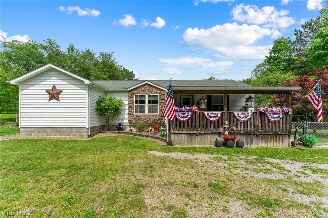 Welcome home to peaceful country living! Situated on 2.85 scenic acres, this well-maintained 3-bedroom, 2 full bath ranch offers approximately 2,400 square feet of comfortable living space with the perfect blend of indoor and outdoor functionality.
Step inside to a spacious kitchen featuring a center island, abundant cabinetry, and a walk-in pantry, providing plenty of room for cooking, storage, and entertaining. Just beyond, you'll love the expansive family room addition, complete with a cozy wood-burning stove and ample space to gather with family and friends. The ranch layout offers convenient one-floor living with multiple handicap-accessible features, including ramp access.
Enjoy peaceful mornings on the inviting covered front porch or unwind on the side porch while taking in the beautiful country views. Outside, the property truly shines with a 2-car detached garage, three additional outbuildings with electric, and a large pavilion offering endless potential. With space suited for a future kitchen and bathroom, the pavilion could easily be transformed into a year-round entertaining area, workshop, or recreational space.
Additional highlights include a spacious crawlspace with approximately 5-foot clearance, exterior access, French drains, and insulated walls for added functionality and storage.
Whether you're looking for room to spread out, space for hobbies, or simply a quiet place to call home, this property offers the perfect combination of acreage, versatility, and comfortable country living. Don't miss your opportunity to own this exceptional property!
