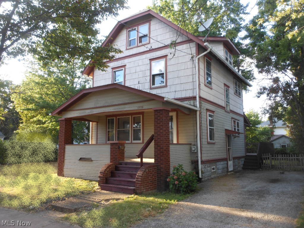 This 2 1/2 story home offers 3 bedrooms on the 2nd floor and 1-2 bedrooms on the 3rd floor. Plus, it includes an extra lot with a 2-car garage. There is natural wood trim in the living room and dining room. The living room has a decorative fireplace with bookshelves and windows above, The stair case features a partial wall of natural wood from the original construction. The living room and dining room are separated by partial wood walls and columns. And, the dining room has built-in wood cabinets and a window seat. The kitchen has extra room which ideal for cooking and baking and it opens to a breakfast room with windows overlooking the deck and back yard. The home has a lot to offer and just needs your finishing touches and attention to miscellaneous details. Most likely the mortgage payment will be less than rent. Invest in your future today.