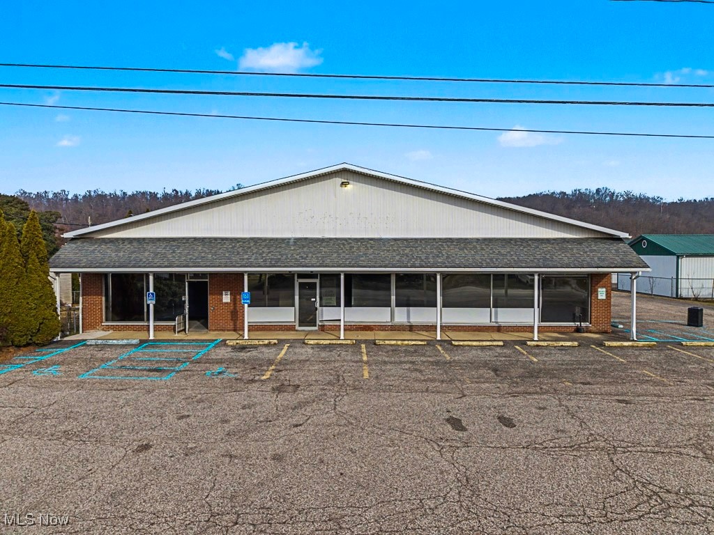 Well-located commercial building situated near Marietta Memorial Hospital and the Belpre Medical Campus, offering exceptional visibility and accessibility in a high-traffic medical and professional area. The property’s most recent use was a medical complex and is well-suited for continued healthcare or professional services. The building offers approximately 15 on-site parking spaces and convenient access from Washington Boulevard to OH-7, US-50, and I-77, providing easy connectivity throughout the Mid-Ohio Valley. Centrally positioned approximately 20 minutes to Marietta, Ohio, 10 minutes to Parkersburg, West Virginia, and 30 minutes to Athens, Ohio. This versatile property presents an excellent opportunity for owner-occupants or investors seeking a strategic location near major healthcare hubs. Potential Commercial Uses Include (subject to zoning approval): Medical or dental office, 
Physical therapy, rehabilitation, or specialty clinic, Counseling or behavioral health services, Professional office (legal, accounting, insurance), Outpatient healthcare services, Wellness center or diagnostic services, Non-profit or administrative offices. 
A rare opportunity to establish or expand your business in a highly desirable medical and professional corridor.