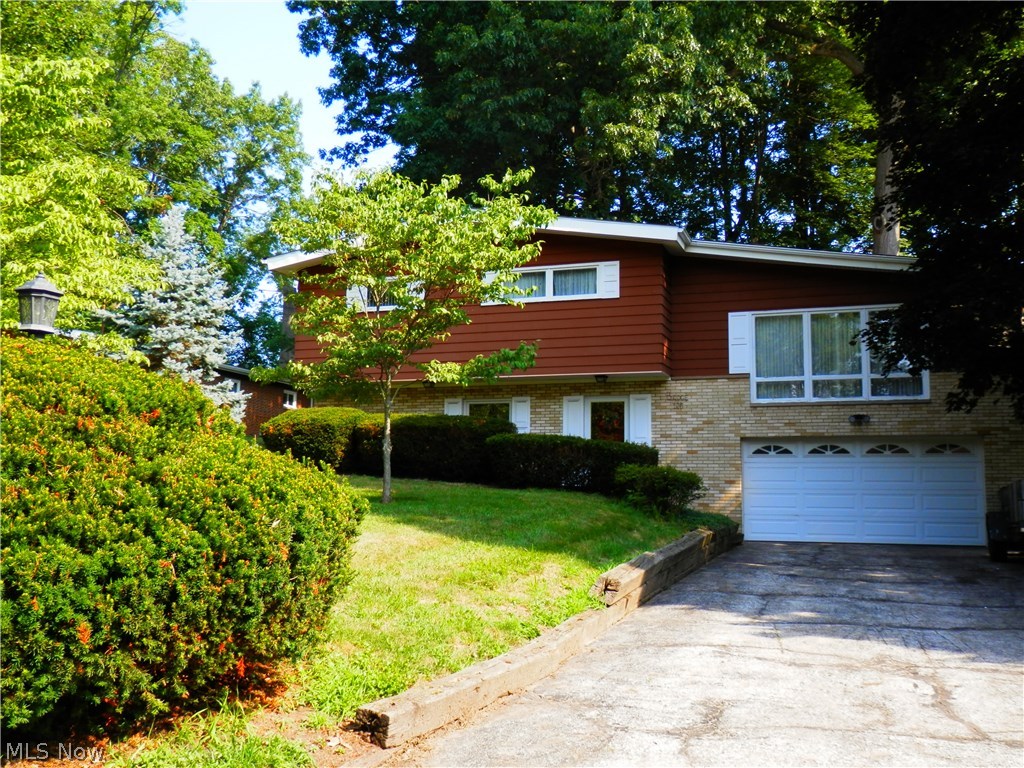 Nice 3 bedroom 2.5 bath split level in a desirable Munroe Falls neighborhood.  This home has a beautiful wooded back yard that is perfect for family get togethers or relaxing in the hot summer.   The upper level of the home has hardwood floors under the carpet, leaving the buyers an option when personalizing the home. This lovely home is priced right so the buyers can add their own personal touches. This house won't last long, schedule your showing soon.