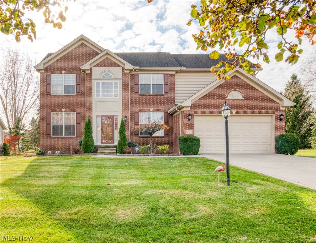 The time, talent, and treasure poured into this beautiful colonial is immediately evident upon pulling into the lush, green, grass-flanked, drive. It only gets better when you enter the front door greeted by a spacious two story foyer leading to an open-concept first floor that is spacious and cozy at the same time. That warmth is amplified by the grand, stone-adorned, gas fireplace which can also be enjoyed by whether prepping a meal or enjoying one in the kitchen. The home boasts a room on each side of the foyer. To the left you will see a spacious dining room with direct access to the kitchen. To the right is a space currently being used as an office, but is just waiting for you to make it your own. The main floor is also where you will find the master bedroom with his and hers walk in closets. In the gorgeous master bathroom, you will find a luxurious soaking tub flanked by his and hers sinks. From the master bedroom, you are close to the laundry room where you will also find garage access. The garage is equipped with a hook-up for an electric car charging station. Upstairs you will find three bedrooms, a full bath, and a sprawling bonus room. The bonus room overlooks most of the first floor and is a sanctuary for the natural sunlight that shines in from the large windows all throughout the home. It is also important to note the beautiful crown molding, baseboards, and chair rails that only accentuate the beauty of this home. Finally, take a look out back and find a large deck covered from the elements by a remote controlled retractable awning and surrounded by a flourishing landscape.