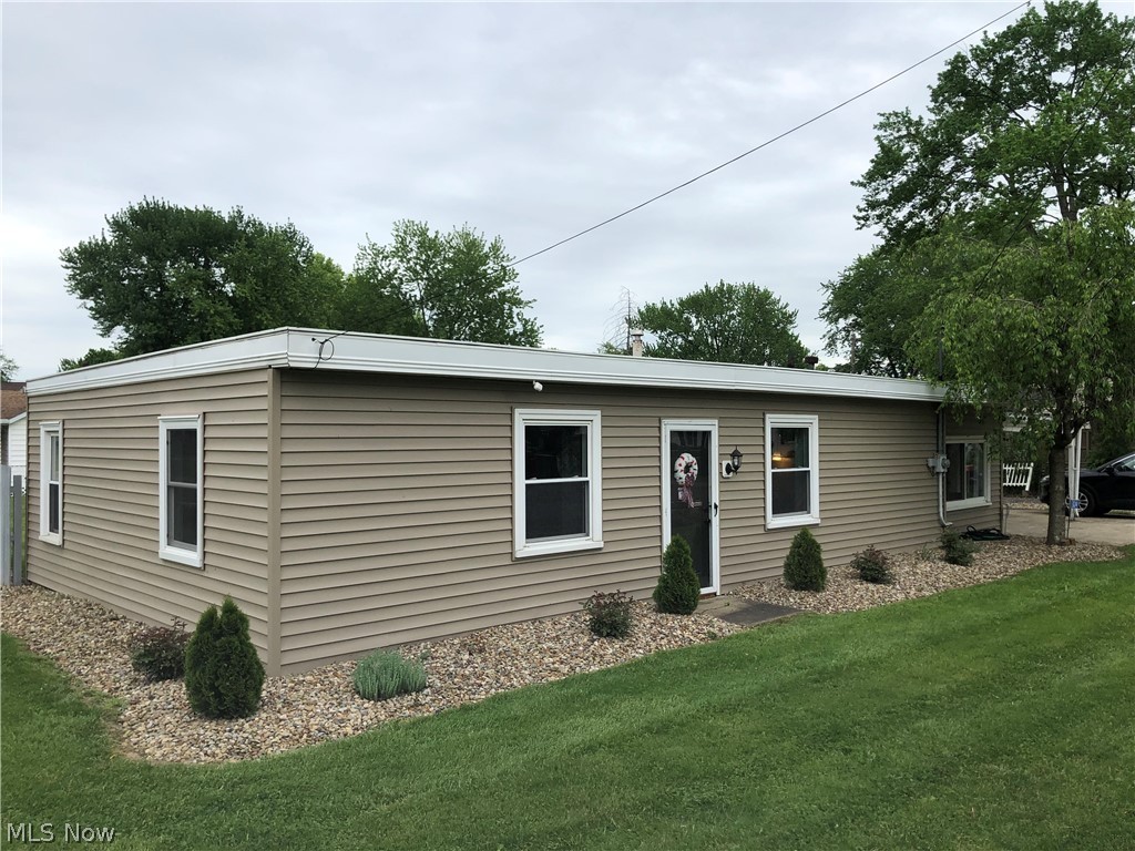 Spacious one floor living in Perry Twp.  Come take a look at this ranch home offering two nice sized bedrooms, family room, large living room, open kitchen with bar, first floor laundry, huge fenced yard meticulously landscaped with covered porch.  Perfect for anyone wanting first flooring living, first time buyer, downsizing or an investment.  Motivated seller!