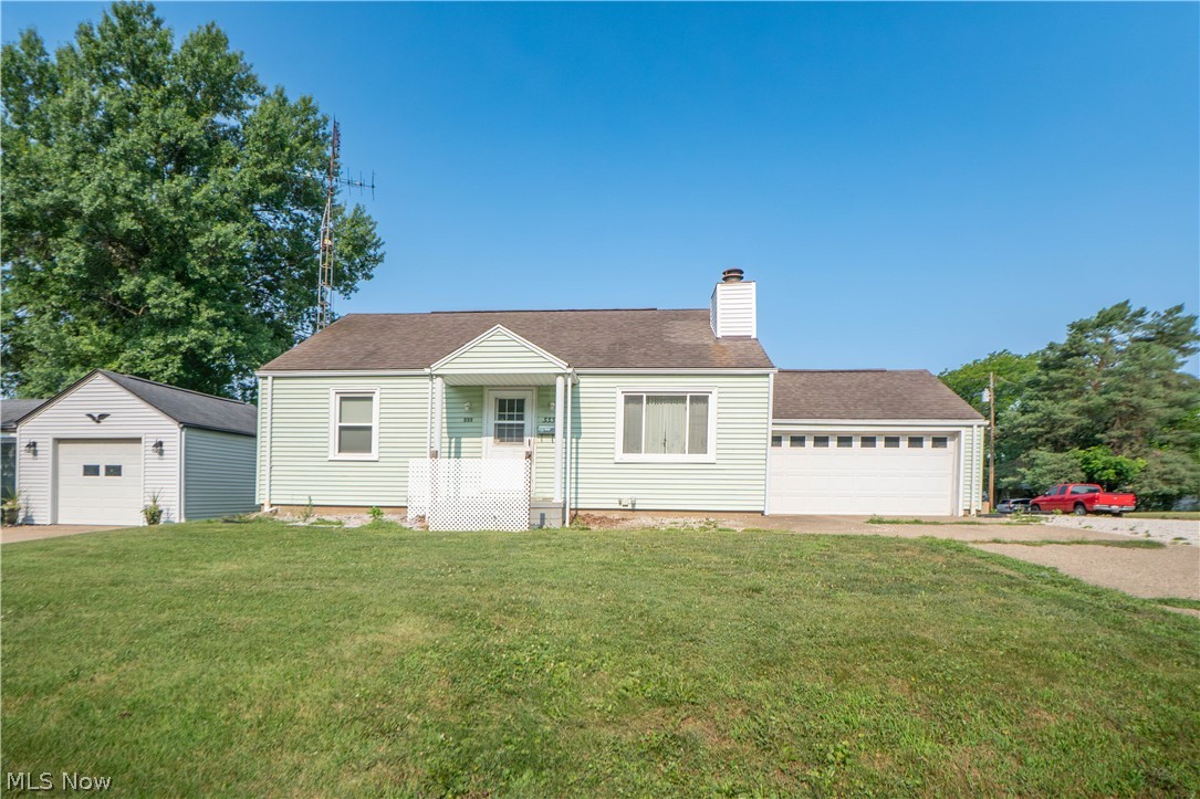 Charming bungalow on a corner lot with an attached 2-car garage, concrete driveway, with additional gravel parking. A covered front entry welcomes you inside to a bright living room featuring hardwood floors, recessed lighting, and a fireplace that creates a warm focal point. The living room flows easily into the eat-in kitchen, where stainless steel appliances, ceramic tile flooring, and a breakfast bar provide both function and everyday convenience.

Down the hallway, built-in storage adds charm and practicality, leading to two comfortable main-level bedrooms with hardwood floors and a full bath with a tub/shower combination. The unfinished lower level offers washer and dryer hookups, additional storage, and a second full bath, giving the home extra flexibility and useful space.

Off the garage, the enclosed porch provides a great bonus area for relaxing, hobbies, or seasonal enjoyment. From there, step out to the partially fenced deck, perfect for outdoor dining or entertaining. The backyard offers plenty of room to enjoy, along with a storage shed for lawn equipment or extra storage. With central air, public utilities, an attached garage, outdoor living space, and a convenient Massillon location, this home offers comfort, function, and great potential inside and out!