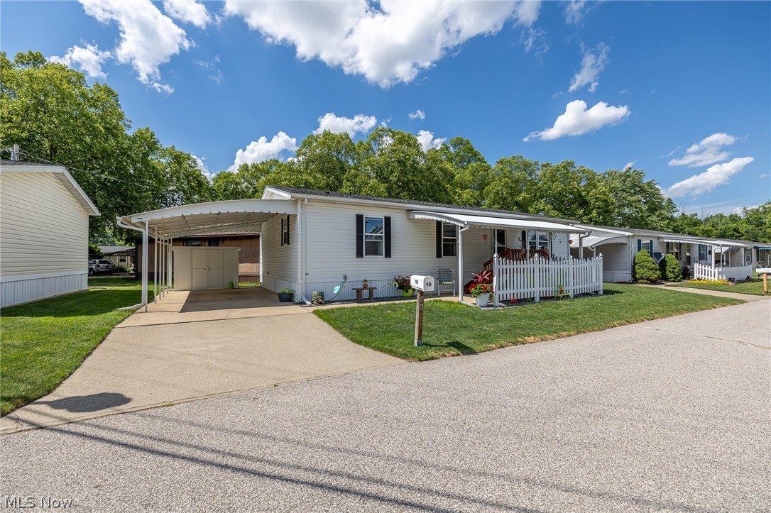 COLUMBIA Park IS A 55 AND OLDER CONCEPT OF LIVING and is Ohio’s Premier Adult Land Lease Community! Amenities Include: Gated entrance! On site Shopping Plaza! On site Management! Walking Path/Dog Walking Path! Shuffleboard! Bocce Ball! Library! Crafts, and Social Hall!  WELCOME HOME TO THIS ADORABLE HOUSE!!!!!!!!! This Schult Manufactured Home offers 1156 sqft featuring 2 Bedrooms, 2 Full Baths, Formal Living and Dining Room, Kitchen and Laundry Area.  This home has been so nicely maintained, it is spotless and so much natural light comes through.  Going back into the archives we found the following information.  The roof was replaced in 2013, the HVAC System replaced in 2021, hot water tank in 2022 and new carpeting in 2013.  There is a Beautiful patio for entertaining or having that first or last beverage just being alone and chilling out.  It also has that White Picket Fence we all dreamt about at one time in our lives.  Come see for yourself, it is home the moment you walk in the door!!!!!!!