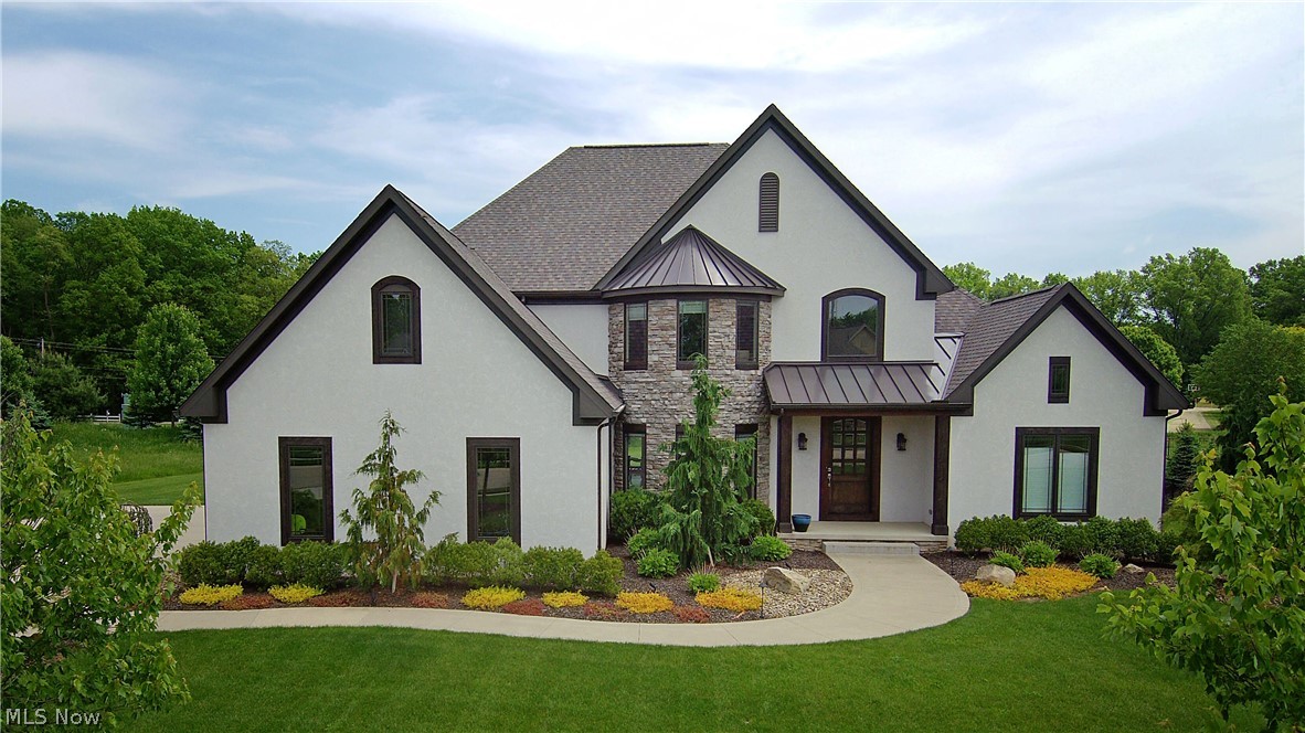 All reasonable offers will be considered.  Custom built home in Jackson Township/Sauder Elementary on .97 acres on a cul-de-sac. The home has a contemporary flair with a great deal of natural light. You are welcomed by a large open foyer and the beautiful custom stained hardwood floors cover the entire 1st floor and part of the 2nd floor. Great room has a large stone gas fireplace. The great room has a view of the stunning cable railing staircase. There is a large office/den/dining room with a custom barn door. The great room opens to a large gourmet kitchen with stainless steel appliances and also includes an ice maker on the island. Large dinette area that flows with the kitchen. There is also a breakfast nook that is perfect for that morning coffee. Master bedroom is located on the 1st floor with tray ceilings and what a bonus, separated his and her closets. Double master bath vanities made from custom bamboo. Large tiled walk-in shower with a transom window. The second floor had 3