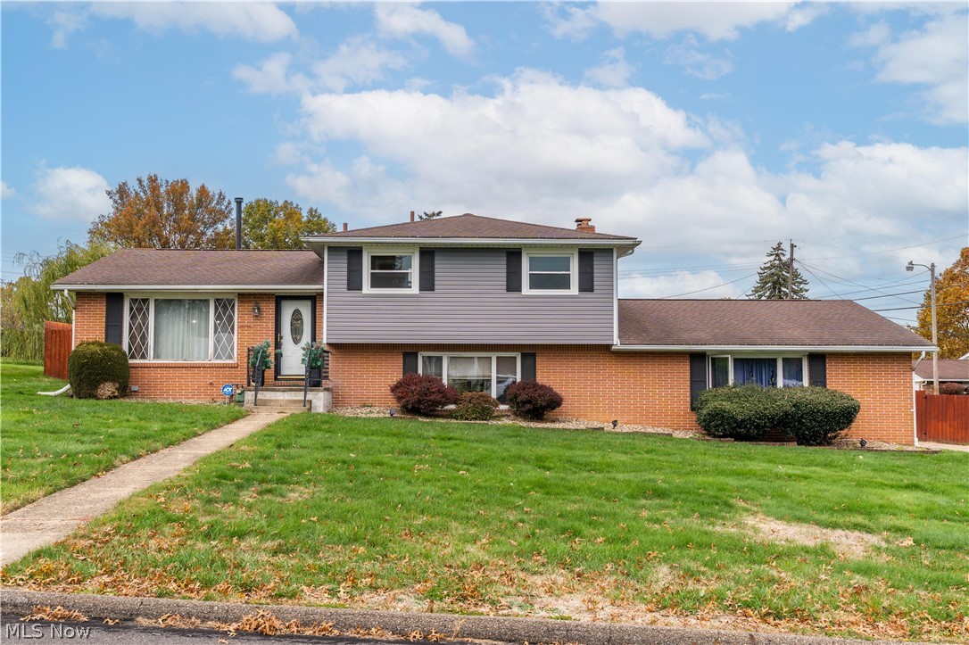 Welcome to 1227 33rd St NE, Canton, OH 44714, a charming split-level home in Plain Township!  This beautifully maintained 3-bedroom, 2.5-bathroom home offers 1,716 sq ft of comfortable living space on a spacious 0.33-acre corner lot.  Built in 1965, the home features a warm and inviting layout perfect for both relaxing and entertaining.  Step into the large family room complete with a cozy fireplace and built-in bar, ideal for gatherings.  The kitchen comes equipped with an oven, range, and refrigerator, and flows seamlessly into the dining area.  Upstairs, you?ll find three generously sized bedrooms and two full baths.  Additional highlights include:  Oversized 2-car attached garage with opener, Full basement offering ample storage or potential for finishing, Central air conditioning and efficient gas heating, Durable vinyl siding and brick exterior.  Updates include new roof in May 2026 and furnace in April 2026. Located in the desirable Plain Local School District.  Conveniently situated near shopping, dining, and parks, this home combines classic charm with modern comfort.  Don't miss your chance to own this gem in a quiet, established neighborhood!  Schedule your private showing today!
