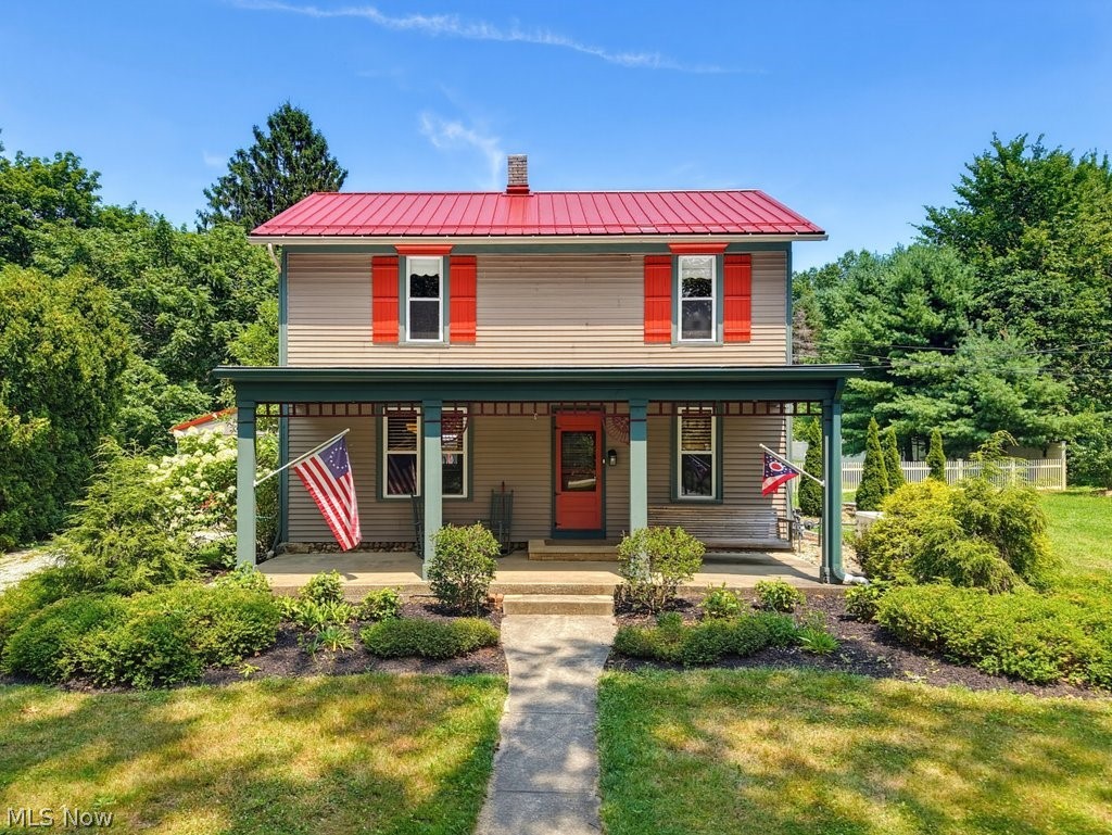 Welcome to an amazing one-of-a-kind farmhouse, situated on a picturesque 2.43-acre lot in the heart of Stow! This incredible home is a mixture of old farmhouse charm paired with tasteful modern convenience. The exterior features TWO delightful porches, including an oversized front porch and a spacious wrap-around framing the side and rear of the home. A detached two car garage leads to an incredible 22x20 workshop with heat and A/C, along with a private entrance. Beyond the garage/workshop is a small barn with four stalls and running water, leading to a partially fenced pasture with room to expand. A functioning chicken house currently houses 6 happy chickens that can convey with the property. The farmhouse has character galore and features: beautiful wood floors, a kitchen with granite counters and updated wood cabinets, 9' ceilings throughout the first floor, a HUGE 24x18 great room with a wood-burning stove and mini split unit, an updated metal roof, a walk-in closet with cedar flooring, 2.5 bathrooms, city water and sewer, and much more!
