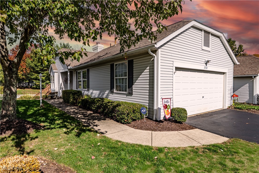 Welcome to 2703 York Dr - a stunning condo at popular Woodbury! This condo has been beautifully maintained through-out and shows like a model! There are so many extras. The owner has finished the lower level with a huge family room, a large bedroom, with an egress window, a full bath, and a kitchenette with a bar, a refrigerator, and cabinets for storage. Back up to the main floor you will find a large great room with a vaulted ceiling, a window seat, and a gas fireplace that you will enjoy on those cold winter days! The great room opens into a beautiful formal dining area with a bayed window and trayed ceiling. The kitchen is fully applianced with oak cabinets, granite counters, a breakfast bar, and a lovely built-in area over the stairway for additional storage. Off the dining area is a door that leads to a screened porch (the perfect spot for relaxing with a glass of wine)! There is a ceiling fan for those warm summer evenings, and from the screened porch there is a door leading to the deck and steps down to the side and back yard. There is a huge master bedroom with a vaulted ceiling, a ceiling fan, and a cozy nook - the perfect spot to curl up with a book. The master bath includes a walk-in closet and a gorgeous step-in tiled shower. The 2nd bedroom is located directly across from the main bath, making it the perfect guest suite. Off the hall is the laundry room that includes a wall of cabinets for storage as well as a closet that could be a pantry, a coat closet, or just additional storage, and a sink for washing those delicate hand washables. There are custom blinds and custom window coverings thru-out, as well as upgraded lighting or ceiling fans in every room! This condo is so inviting that the moment you step inside you will want to claim it for your own! In addition, the owner is offering a one-year home warranty for the buyer's comfort! Don't miss your opportunity to own this gorgeous condo!