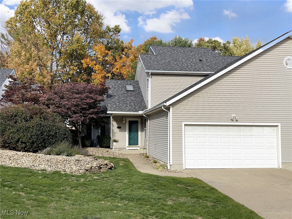 Enjoy maintenance free living in this lovely Tallmadge condominium that I bet you thought you'd never find. Beautiful from top to bottom, this unit offers the traditional benefits of a condo with the spaciousness of a single-family home. The entire home features lots of natural light and energy. The delightful interior begins through a foyer with skylight, to an 18 ft. great room with vaulted ceilings, that lead to the kitchen with an ample supply of cabinets and appliances that stay. You'll have your pick of the three bedrooms. You can choose to make your primary bedroom upstairs, with large en suite bath and extra bedroom close by. You can also choose the hard-to-find 1st floor bedroom, that can also easily double as a home office or work out area, with a second full bath and laundry close by! The sleeping possibilities will be great for when guests come in town, and the open floor plan will be a treat when it comes to entertaining and decorating. Updates include new luxury vinyl flooring in the living areas, great for easy upkeep and for getting around, and a brand new roof went on just this year, which should provide peace of mind. For storage, you'll appreciate the extra room the large 2-car garage provides, and for relaxing, a lovely, private outdoor patio backs up to a peaceful green space. Being in this prime Tallmadge location, you'll love being in close proximity to all that Tallmadge has to offer, including numerous adult and youth sports programs, special events, and the Tallmadge Rec Center, that hosts all kinds of special holiday and family events such as Music on the Circle and the City of Tallmadge Tree Lighting Ceremony with carols, crafts and the lighting of the giant Christmas tree. You will not want to let this one get away!