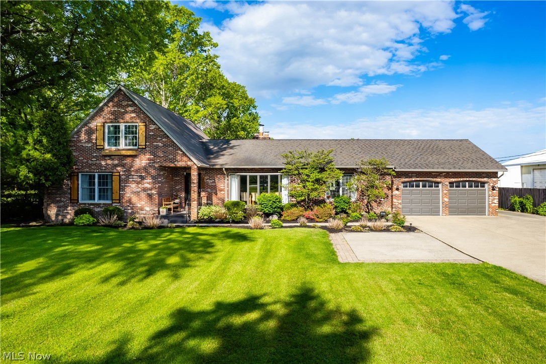 Set on 1.5 private acres, this exceptional 5 bedroom, 3.5 bathroom Avon home provides a perfect blend of country tranquility and city convenience. With over 2,800 square feet, a finished lower level, and a heated outbuilding, this property is ideal for those who enjoy having room to entertain and need space for specialized hobbies. Inside, the main level has been opened up to create a welcoming flow between the foyer, dining room and kitchen, allowing family and guests to gather comfortably from every angle. The family room features a cozy wood burning fireplace and sliders that lead outside. At the center of the home is a stunning entertainer’s kitchen showcasing custom two-tone cabinetry, high end appliances, and exceptional attention to detail. Just beyond the kitchen is a dry bar with a wine fridge and additional cabinetry, renovated half bathroom, and laundry room. On the other wing of the home is a 1st floor primary suite with beautifully updated full bathroom. Completing this level are two additional bedrooms and  full bathroom. Upstairs, there are two large bedrooms and another full bathroom creating a perfect retreat for guests, family members or additional workspace needs. The finished basement expands the living space even further with a workout room, rec area, second laundry room, and entertainment space with gas fireplace, and full second kitchen which is perfect for hosting, extended stays or everyday flexibility. Outside, the backyard is designed for relaxation and entertaining with a massive deck featuring a built-in pool and hot tub overlooking the expansive property. The heated outbuilding with electricity is currently set up for woodworking and vented for that purpose, but offers endless possibilities for hobbies, storage or a workshop. Rarely does a property in Avon offer this much land, privacy and updated living space. Come see today!