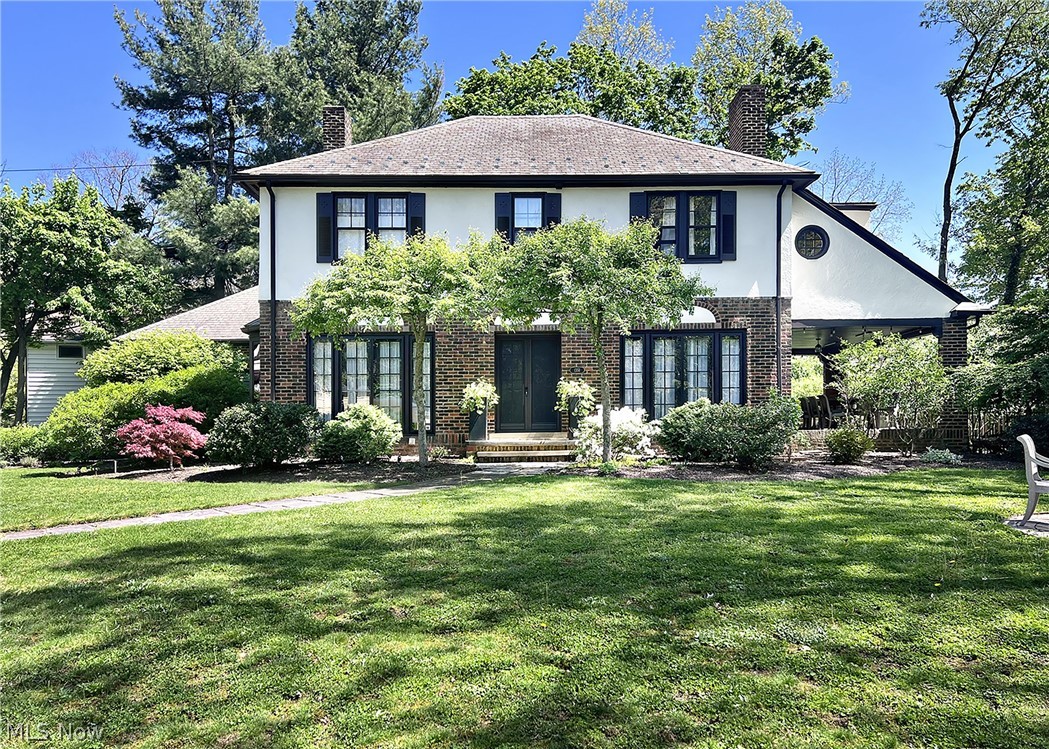 Nestled within the historic Inglewood District of Cleveland Heights, 1351 Oakridge Drive is a rare offering where timeless architectural character and thoughtful modern updates come together beautifully. Developed by the renowned Van Sweringen brothers as part of the visionary Shaker Heights Improvement Company, the Inglewood neighborhood was designed as a distinguished collection of architecturally unique homes inspired by English Tudor, French, and Colonial styles — ensuring no two residences were ever exactly alike.  Completed in 1927 and showcasing classic Colonial Revival design, this exceptional home offers beautifully preserved woodwork, leaded glass windows, graceful architectural details, and a stunning staircase that immediately captures attention. The classic stucco exterior, professional landscaping, attached garage, newer driveway, and inviting statement side porch create extraordinary curb appeal while honoring the home's rich heritage.  Inside, tasteful updates complement the original craftsmanship to suit today’s lifestyle. The statement kitchen is truly designed for the gourmet chef, featuring top-of-the-line appliances and abundant space for everyday living or memorable entertaining. The spacious primary suite offers a walk-in closet and private full bath, while three additional bedrooms and additional updated full bath provide flexibility for guests, work-from-home needs, or growing households. A charming walk-out balcony adds yet another distinctive architectural touch.  Modern conveniences include newer central air conditioning, while the lower level delivers unexpected luxury with a wine cellar and sauna — both conveying with the home. Offering approximately 2,126 square feet of living space, not including the remarkable side porch, this is a unique opportunity to own a piece of Cleveland Heights history thoughtfully curated for contemporary living.  All of this including Point of Sale Compliance is ready for the next fortunate owner.