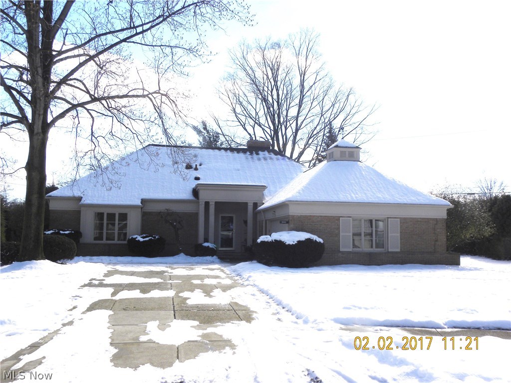 Welcome to 3849 E. Surrey.  This gracious all brick home is perfectly situated on the back of a quiet cul de sac and offers over 3600 square feet of living space.  
The living room and dining room are large, with large windows looking out on the beautiful back yard.  The wood burning fireplace adds warmth to the living room, while the sliding doors in the dining room offer easy access to the covered patio.  The family room is welcoming with built ins  and warm parquet flooring.  There is also access to the back yard from the family room.  The eat in kitchen is light and bright with tons of storage.  The two downstairs bedrooms, each with their own en suite, are over sized with great storage.  A well appointed laundry room and updated half bath round out the first floor.  Two large bedrooms and an additional full bath can be found on the second floor, along with lots of storage space. The lower level features an additional living space complete with a wood burning fireplace and half ba