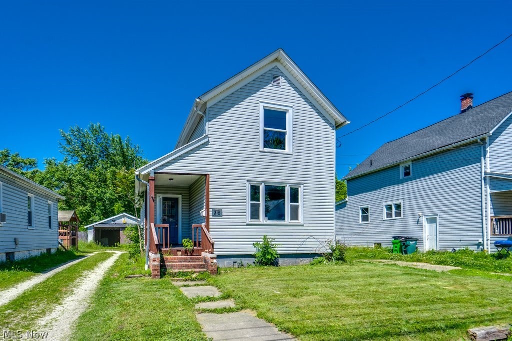 Welcome to this 3-bedroom, 1.5-bath home featuring a functional floor plan and comfortable living spaces. The main level offers a living room, dining room, first-floor bedroom, kitchen, and a full bathroom. Upstairs, you'll find two additional bedrooms and a convenient half bath. The basement includes laundry hookups and provides additional storage space. Outside, the detached garage offers off-street parking and extra storage options. Conveniently located with easy access to local amenities. Call your favorite realtor for a showing today.