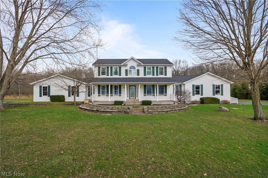 "Country Roads...Take Me Home" Welcome to this peaceful country retreat located on a quiet rural road in the heart of Columbiana County, offering convenient access to Salem, Lisbon, Columbiana and Route 11.  This beautiful two story traditional home offers curb appeal galore and sits on over 3 scenic acres with woods at the rear of the property and a ramped back deck overlooking a peaceful yard featuring fruit trees, grapevines and blackberry bushes. Inside you'll find 3-4 bedrooms and 3 1/2 bathrooms, including a versatile first-floor den that could easily serve as a fourth bedroom or home office and is adjacent to a first floor full bathroom. Large First Floor Laundry Room. The spacious eat in  kitchen is the heart of the home, featuring quality oak cabinetry, abundnat counter space, and a huge center island perfect for gathering and entertaining. The adjoining family room offers a warm and inviting atmosphere with a cozy brick fireplace. A unique attached party room adds exceptional flexibility, complete with a second full kitchen and opens to the exterior deck-ideal for summer entertaining or easily converted into a private in-law suite. Upstairs you'll find 3 comfortable bedrooms including the primary suite with cathedral ceiling, walk-in closet and a private en-suite bathroom. 2 additional bedrooms and a full hall bath complete the second floor. Car enthusiasts and hobbyists will appreciate the oversized two-car attached garage plus a three-car detached garage with workshop area. An additional shed provides convenient storage for a riding mower and tools. Additional highlights include a whole House Generator, New roof 2022, New West Windows 2025, New HWT 2025..to name a few. Pride in ownership in this well maintained home. If your looking for a move in ready and spotless clean home offering space, privacy and a country setting with modern conveniences this property has it all plus a fresh coat of paint! A bonus Home Warranty is included for peace of mind.