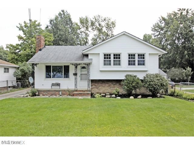 Wonderful split level home w/a basement. Has hard wood floors with some carpet.All 3 bedrooms offer generous closet space. 
All appliances,Stove,Refrigerator,Dishwasher,Microwave,(2014),Washer/Dryer(2015) to remain with the home. Soft close kitchen cabinets and quality insulated windows(2014) offers low heating and a/c bills.Living room carpet (2015). Both bathrooms remodeled in (2014), New electric in 2014. Furnace with humidifier and A/C in 2001.Surround sound system installed 2016 with rear speakers.New 50gal HWT in 6/2016.A fantastic wood burner in family room. Great for the Cleveland cold wintry nights.A brand new FLAT screen color TV is being left for your family's enjoyment. Sellers are offering a 1 yr Home warranty for it's new owner .Super close to highways,shopping,& medical facilities.