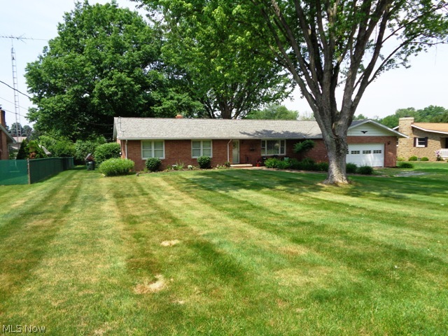 Well Maintained & Updated Three Bedroom Brick Ranch w/2659 Total Living Space Including Rec Room In Lower Level & 2nd Kitchen Perfect For Family Gatherings. Spacious Living Room w/Picture Window. Fully Applianced Kitchen Overlooking Dining Room w/Nice Views Of Backyard, Large Island/Breakfast Bar & Pantry. Relaxing Family Room. Full Bath. Master Bedroom w/2 Double Closets. 2nd & 3rd Bedrooms. Full Bath w/Double Sinks. Two Car Garage. Outbuilding. Beautiful Patio w/Fire Pit Area For Entertaining! Updates Include: Roof, Stone Patio, Stainless Appliances, Island/Breakfast Bar, Full Bath, Garage Door, Exterior Doors, Flooring, Interior Paint Plus More. "Special Financing Incentives Available On This Property From Sirva's Preferred Lender". Enjoy This Rural Setting With The Conveniences Of Public Utilities & Easy Highway Access!