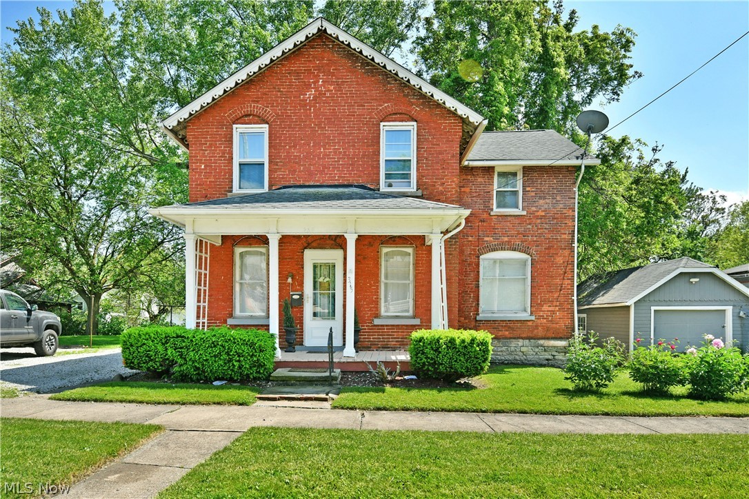 Two stories of beautiful, all-brick living await this engaging Niles home! This semi-historic home is set just moments from the bustling attractions of downtown shopping and dining alike, all while providing its oversized lot that proudly displays its rich heritage and handsome looks. A pillar lined and covered front porch adds to the curb appeal as tidy landscaping joins a large storage shed sitting nearby. Around the back, a covered patio overlooks the natural backstop, taking full advantage of the tree provided shade. Inside the residence, each room delights with color, personalized touches and plenty of style that aligns with the vintage home’s appeal. The formal front entrance opens to a brightly lit living room where natural light spills across the hardwood flooring below. A sculpted chair rail runs along the near wall, adding to the attraction. Around the corner, a central dining room invites with bold colors and a hidden first floor half bath. Prepare your favorite meals in the surprisingly spacious and versatile kitchen, boasting wrapping countertops, stainless appliances and first floor laundry services that sit outside of additional bar top dining. Upstairs, a deep-set full bath greets you at the landing while the elegantly appointed master bedroom branches away from across the hall. Two additional bedrooms include a larger rear room, each with ample closet space. A full basement resides below for storage.