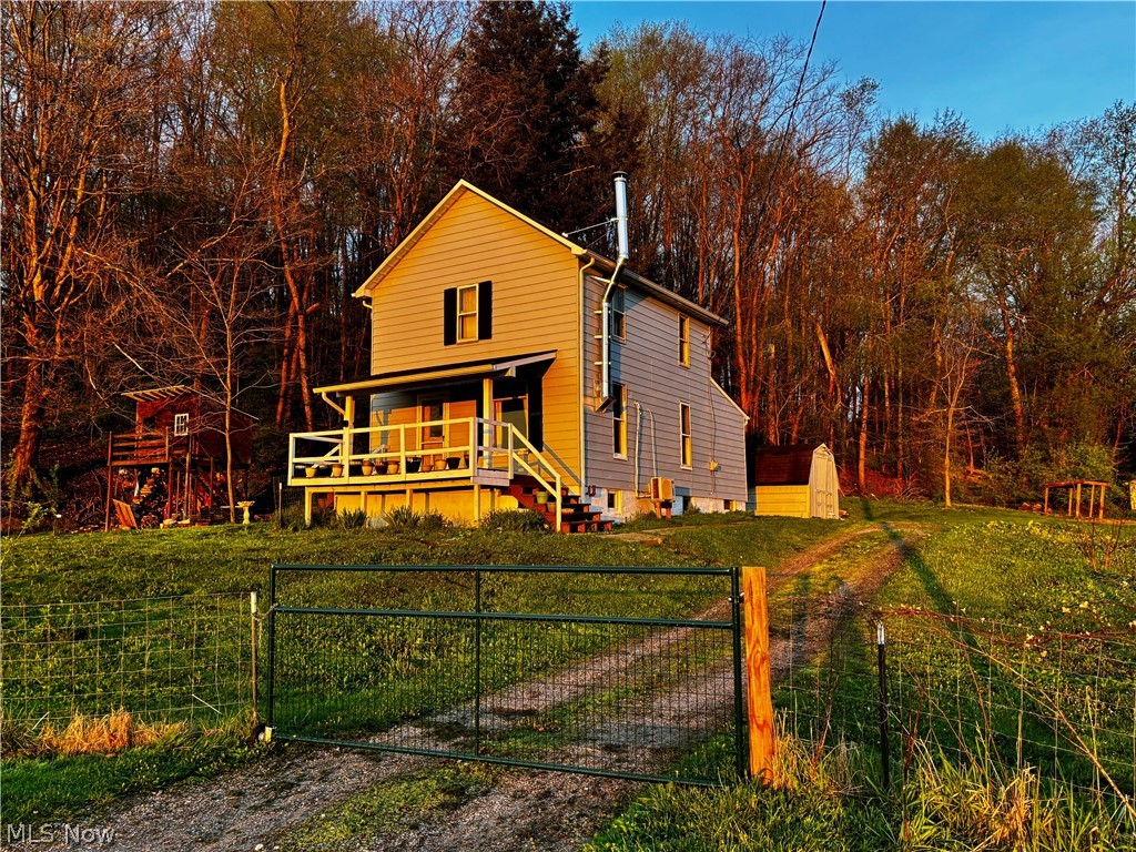 Charming farmhouse situated on nearly 2 acres with breathtaking views and abundant wildlife right outside your door. This beautifully updated home offers the perfect blend of country living and modern peace of mind, featuring a new roof and gutters, fresh paint throughout, and completely updated plumbing and electrical systems. Whether you're looking to start a homestead or simply enjoy privacy and open space, this property delivers. Enjoy the tranquility of rural living while still being just minutes from town conveniences, all within the Minerva school district. A rare opportunity to own your own slice of countryside.