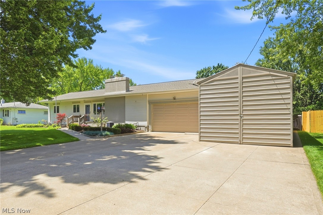 Rarely do you run across a truly special home like this one. Move-in ready and located in one of Coventry Township’s premier neighborhoods, this 2-3-bedroom ranch has been home to the second owners, for over 40 years. As such, everything here has been done over years of loving care. After a walk in from the meticulously landscaped front yard, you’ll enter the lovely living room with gas fireplace, pretty picture window and ample room for seating. The gleaming kitchen is knockout. It was done by the local Crookston family, with all of the special cabinetry and elements handpicked by the owners. If you’re having company over for dinner, the dining room flows from the living room in a special way that it will hold a long, full size dining table and China cabinet. Two bedrooms combined, made the 23 ft. long primary bedroom large enough for a King Size bed, vanity and extra furniture. Custom-made shelving in the second bedroom will be great, especially if you like to keep a home office. The lower level has served as a third bedroom for the owners for years. It can also double as a family room or an all-round entertainment space. You’ll have the 4-season sunroom you’ve always wanted, with this home. It’s light, bright, features a vented gas fireplace and has patio door access not only to patios at each end, each with hard top gazebos that stay, but it overlooks the spectacular back yard with a 12x20 storage building, a 10x20 shed and a beautiful yard where every blade of grass knows where it stands. If you’ve always wanted RV storage, you’ll be right at home here. The 14x41 – 10 ft. high, steel-constructed RV outbuilding is spectacular, with 6-inch concrete floor, 30 & 50 amp RV electrical service boxes and a 110v electrical receptacle. That’s in addition to a 2-car attached garage! Better hurry. You won’t want this one to pass you by.