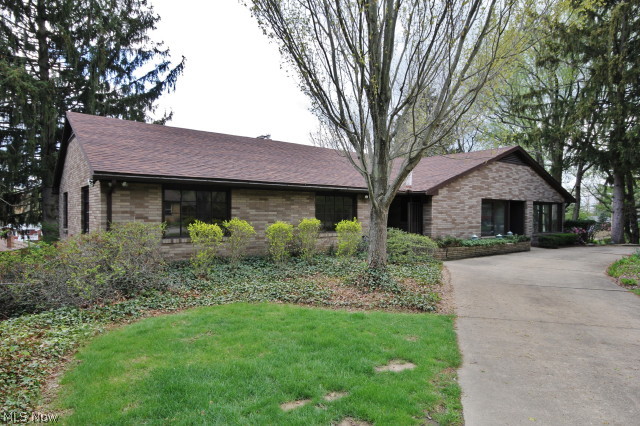 One of a kind home that you don't find often! This is NOT your standard ranch home, you will be sure to enjoy truly unique features that will be sure to amaze you from the beautiful built ins, to the sensible use of space throughout the home. You will appreciate tons of living space with over 2500 sq. ft on the main floor, and not including the finished basement!  First floor library/den that overlooks a park like setting in the rear of the home, with private deck AND enormous sunroom. Wood and tiled floors throughout, marble window sills, and beautiful cathedral ceiling.  Oversized finished walkout basement with additional fireplace, family room, 4th bedroom with half bath. This home has so much opportunity to truly make it fascinating and add your own touch, while highlighting the character that has been highlighted through the craftsmanship.