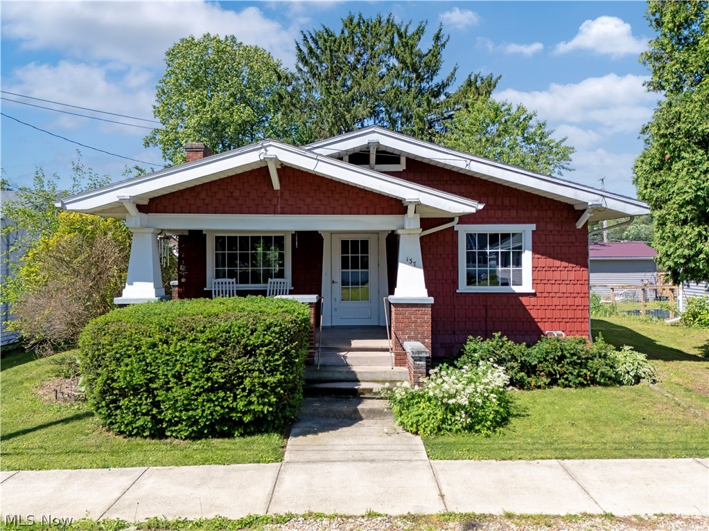 Own a true Craftsman treasure where historic charm meets modern convenience. Estate Sale - Selling As Is. Step back in time and appreciate the craftsmanship of this original Sears Craftsman ranch home located in the Village of Perrysville with city utilities, natural gas heat, and public water. This well-maintained 2-bedroom, 1-bath home offers convenient one-floor living with main-floor laundry, beautiful original woodwork, including a built-in china cabinet - bookcase in the open plan living/dining room area and a built-in cabinet in breakfast room. Hardwood floors, abundant storage, and timeless character throughout.

The kitchen features Corian countertops, updated cabinetry, sink, and includes the refrigerator and stove. Enjoy your morning coffee or afternoon snack in the cozy breakfast room. The bathroom offers a walk-in shower for added accessibility and convenience.
Outside, you'll find a detached garage with electric and remote opener, additional front parking, and multiple covered porches including front, side, and rear porches perfect for relaxing and enjoying small-town living. Window air conditioning unit included. A wonderful opportunity for first-time buyers, downsizers, investors, or anyone seeking a home filled with character and charm. 

Conveniently located near the scenic Mohican area, enjoy easy access to hiking, canoeing, fishing, shopping, dining, and outdoor recreation at Pleasant Hill Lake - Mohican State Park, Mohican-Memorial State Forest, and the charming shops and restaurants in the nearby local areas.