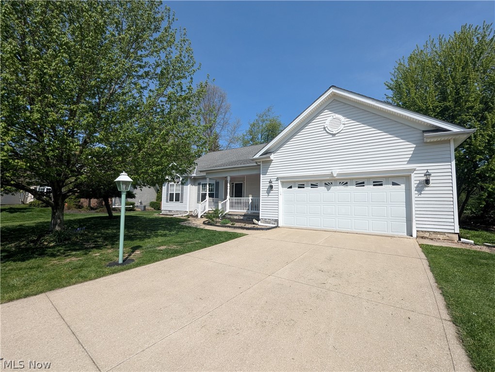 Enjoy the abundance of room that this split ranch has to offer! Tucked away at the end of a cul-de-sac you will find a 6 bedroom (3 on the main and 3 on the lower level) home with 2.5 baths, finished lower level, attached two car garage with hot/cold water, and a detached 2 car garage!  The open floor plan of the vaulted ceiling Great Room with gas fireplace, flows towards the Dining Room to allow for large gatherings! The generously sized eat-in kitchen is a chef's dream! It offers an abundance of counter space, substantial storage, stainless steel appliances, and access to the back yard deck! The Master Bedroom offers privacy and is equipped with it's own master bath and walk in closet! The opposite end of the home offers two bedrooms and a full bath! A wealth of windows throughout to let in plenty of natural light! The added convenience of a main level laundry room! The lower level offers added square footage for more living space! It welcomes you with a large rec area / media room, 3 bedrooms, a 1/2 bath, a home gym area or a simple storage/workshop area, access to the exterior, and a couple of sets of barn doors that add privacy and character! A wide covered front porch on the front and an oversized deck in the back! Some updates in 2024 are new A/C, Hot Water Tank, Sump Pump w/ Battery Back-up, Microwave, Electricity in the detached 2 car garage, Vinyl Plank Flooring in the lower level, and fresh paint throughout. An attached two car garage with a newer door opener system. Make this home your own!