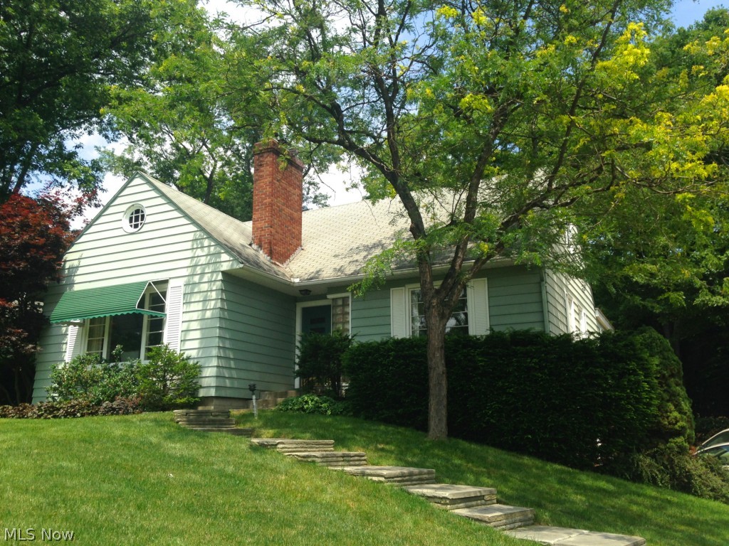 Welcome to 2367 Falmouth, a charming 3 bedroom 2.5 bath cape across from the 8th hole of Fairlawn Country Club golf course.  Walk up the cascading stone steps and turn around for a breathtaking view of the lush green.  Built in 1951, this one-owner 2,444 sqft home was lovingly cared for and ready for its next owners touch.  Large fireplaced living room's picture window highlights sweeping, verdant view.  Dining room with sliders to back patio.  Cozy hearth room off of kitchen features brick wood-burning  fireplace, access to stone back patio and large windows for plenty of light.  1st floor master suite with en suite bath and large private sitting area.  2 cozy bedrooms and 1 full bath upstairs along with large bonus area with tented ceiling - would make a wonderful playroom or craft room.  Basement rec room freshly painted and brand new carpet installed.  2 car attached garage.  Sellers providing 2-10 Home Warranty for peace of mind.  Rare opportunity, don't miss this home and all its