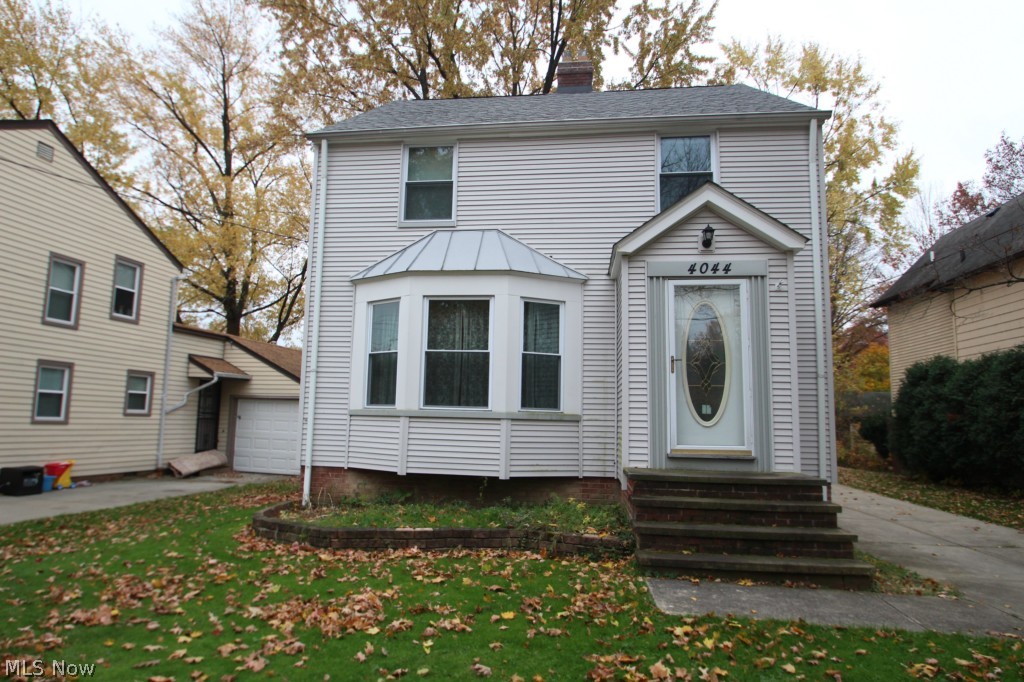 Seller is motivated and willing to consider all reasonable offers. A great home with many updates ready to move in. Beautiful hardwood flooring is featured in most rooms in this two story Colonial. Large living room with gas fireplace and vestibule entry. Formal Dining room has built-in corner hutches and access to the wood deck at the rear of the home. Full basement with space for recreation room and work area as well as glass block windows. Walk-up attic is fully insulated and offers additional storage. Updates include full insulation walls and attic, newer roof on home and garage, siding, windows and concreted drive. Large 2-1/2 car detached garage with work bench. Seller offering a 1 year home warranty with America Preferred