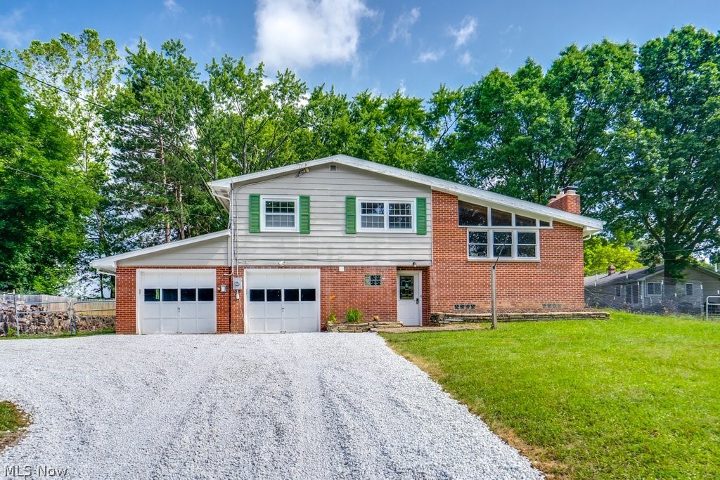 Welcome home to this beautifully updated 3-bedroom home offering the perfect blend of modern upgrades and timeless charm. The home features two fully renovated bathrooms, including a owner's bath with quartz countertops, a double vanity, tiled walk-in shower, clawfoot soaking tub, and all-new fixtures. A former half bath has been thoughtfully converted into a second full bath with a shower for added convenience. The remodeled kitchen includes granite countertops, an undermount sink, over-the-range microwave, center island, and new cabinetry, making it the perfect space for cooking and gathering. Additional major updates include a new roof with 4kW solar panels, new driveway with an extended rear parking area, new plumbing, new water heater, and a whole-home water filtration system. Inside, you'll love the vaulted ceilings, large Pella windows that fill the home with natural light, original hardwood floors, spacious bedrooms with ample storage, and two beautiful brick fireplaces. The partially finished basement provides additional living space, perfect for a recreation room, home office, or workout area. Conveniently located near shopping, restaurants, and within three miles of the elementary, middle, and high schools, this move-in-ready home has it all. Schedule your private showing today!