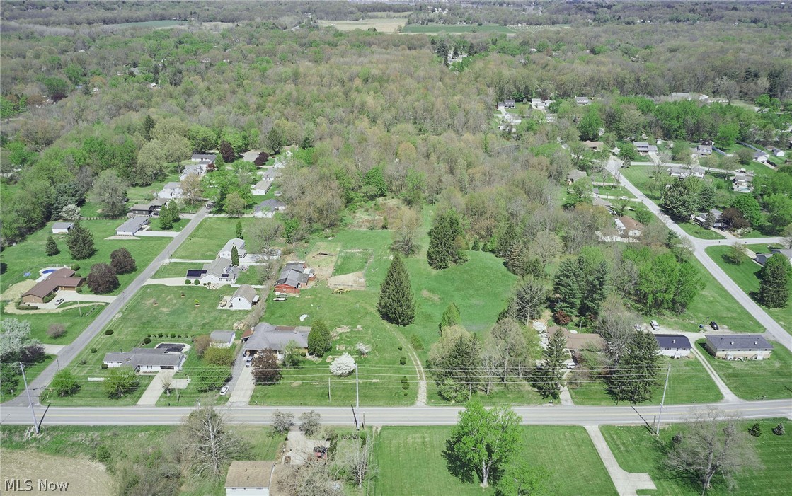Your dream of designing and building your dream home on a multiple acre parcel of land is coming true! This stunning 28+ acre property offers the perfect opportunity to build your homestead, while also blending it with natural beauty and tranquility. To add a little historic charm to this unique site, this beautiful property has been in the same families for nearly 50 years! It features a mix of wooded land, a pond, and your own built-in private nature preserve. There are approximately 3 acres of protected wetlands that will serve not only as a buffer to the busyness of your life, but will also be perfect if you want a front row seat to watch the change in seasons, it will be a recreational haven for birdwatching, and imagine just how educational it will be to experience so many different kinds of wildlife. The possibilities are abundant for future development if you have in mind to parcel off any of the land for family, too! You won’t have to go far, either. Surrounded by well-maintained residences, this peaceful setting is in the family-friendly community of Springfield Township in the highly regarded Springfield Local School district, right between Akron and Canton, with access to all kinds of local amenities. If ever you wish to venture off the property to experience nature, the area has so much to offer including the Springfield Bog Metropark, a partnership of the University of Akron and the Summit Metroparks. It’s a beautiful nature preserve with special daytime and nighttime programs along the 1.6 acre Prairie Trail, and there is Springfield Lake, with over 250 acres of water for fishing, boating and jet skiing. With plenty of room for growth and adventure, this ideal homesite is ready for you to create your own piece of history. I would not let this one pass you by!