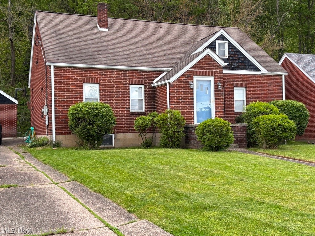 Charming 3-bedroom, 1.5-bath brick Cape Cod on a quiet dead-end street, set on a nice lot with a detached garage. Highlights include a welcoming entry foyer, spacious living room, and an equipped eat-in kitchen with access to a private backyard and covered patio. Two main-floor bedrooms feature hardwood floors, with a large upper-level bedroom plus a versatile bonus room ideal for a home office, den, library or possible 4th Bedroom. Enjoy low West Virginia property taxes and convenient access to Robinson Township, Pittsburgh International Airport, a state park, casino/racetrack, and the PA/OH borders.