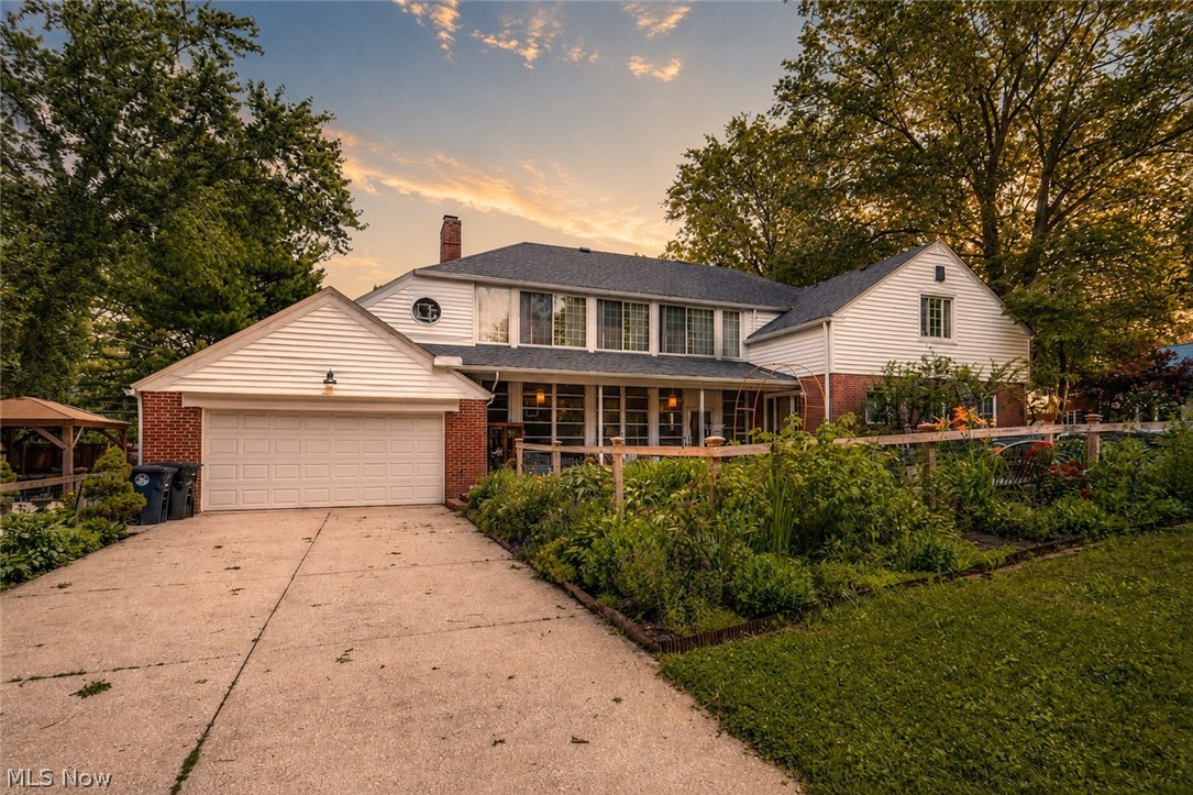 Welcome to this thoughtfully updated West Akron Cape Cod, where timeless character, modern renovations, and indoor-outdoor living come together beautifully. Offering 4 bedrooms, 2.5 baths, and a dedicated home office, this turnkey home features thoughtful architectural details and flexible spaces for everyday living and entertaining. The remodeled kitchen is the heart of the home, designed with an oversized custom quartz island, black granite perimeter countertops, custom cabinetry, unlacquered brass hardware, a large pantry, hidden double-drawer storage, appliance cabinets, counter-to-ceiling tile accents, an updated range hood, new kitchen windows, and seamless flow to the dining and living areas. The main living space offers exposed beams, hardwood floors, built-ins, and a gas fireplace. French doors extend the living spaces on both floors to sunrooms, bringing in natural light and flexible space for lounging, dining, plants, hobbies, or a quiet retreat. These unique spaces also create a helpful all-season temperature buffer, while radiant floor heating throughout the first floor adds warmth and comfort through Northeast Ohio winters. The home office adds another flexible space, while large closets throughout provide extensive storage. Outside, enjoy beautiful landscaping, easy-care perennials, garden beds, and an expanded side yard with a concrete patio and pergola. Covered patio space, garden views, and private-feeling outdoor gathering areas create a rare blend of charm and livability. Major improvements include a new roof, sewer main replacement, added cooling and heating systems, refinished hardwood floors and slate entry tile, fresh interior paint, updated lighting, plus thoughtful cosmetic updates throughout. Set in an established West Akron neighborhood with tree-lined surroundings and convenient access to nearby parks, shopping, dining, and local amenities, this move-in-ready home is full of warmth, updates, and character.