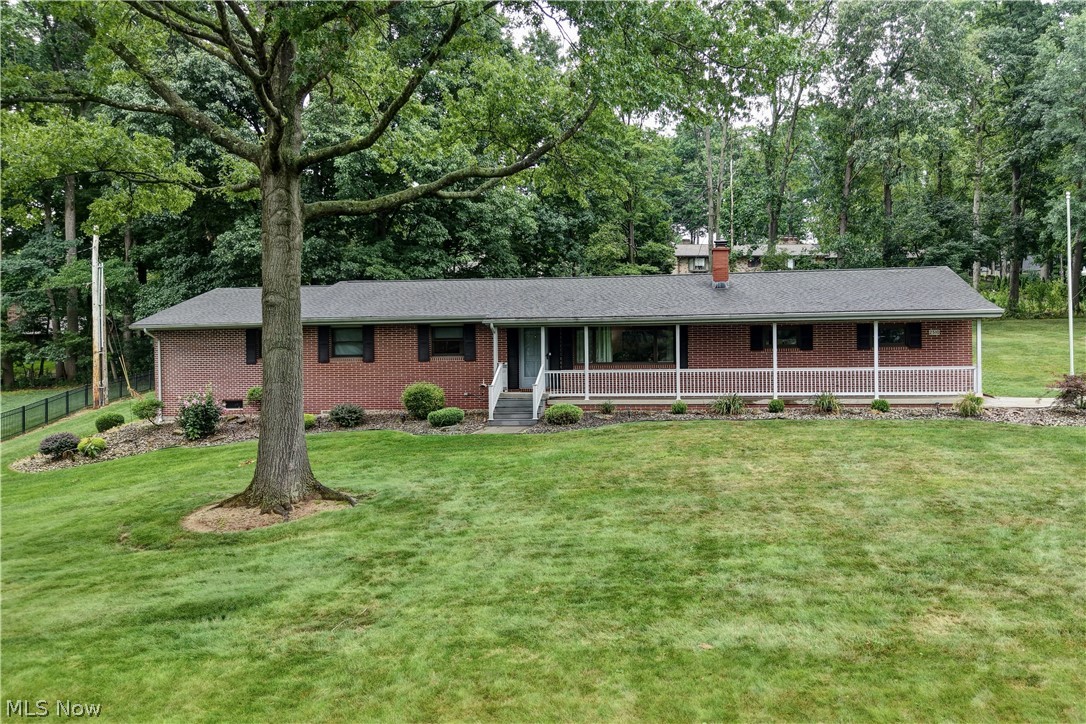 4-bedroom, 3-bath ranch home with additional lot! Total acreage is 1.71 acres. There was an addition to the home making it much larger. 3 bedrooms and 2 bathrooms are on the main floor, 1 bedroom (which in now being used as an office) and a bathroom are in the lower level. Other lower-level features are a family room with a fireplace, and a weight room. Screened in porch off of the kitchen, (Patio furniture stays) newer tile and quartz countertops in kitchen. 2 car attached garage, located in Beautiful Willow Glens.
