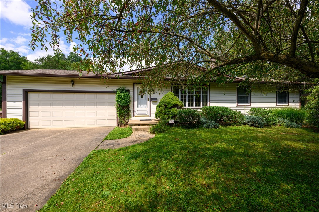 Welcome to this home located in Manchester LSD! This home sits on a half-acre lot with a great wooded view in the back yard. This home has the perfect ability for single story living. As you walk inside, you will first notice how much natural light comes through the living room. The living room also features a great fireplace! The kitchen has a very open concept, and there is a patio door that will take you to a covered deck in the back of the home. The first floor has the ability for laundry, as well as a laundry location in the basement. The bedrooms are very comfortable size with 1 and 1/2 baths on the main floor. The basement has a partially finished bar area that would not need much work to make it your own. The two-car garage has plenty of space for vehicles and storage. Do not miss your chance to schedule a private showing! Recent Updates: Roof - 2020, Water Softener - 2020, New Pump in Septic - 2024, Air Conditioner - 2018.