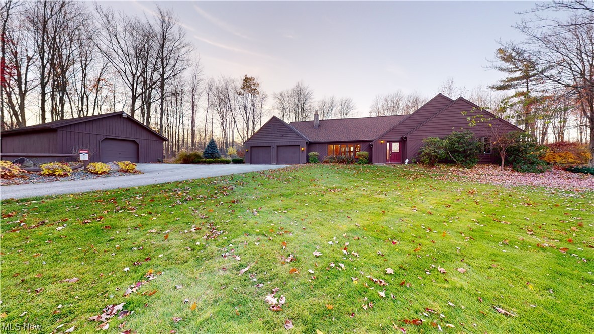 Beautiful large home situated on a parklike yard sits back from the road and has a large barn. Home was originally a 2 Bedroom ranch and the owner added a huge addition including a second floor bedroom and sunporch.  The 2 story great room has a wall of windows and a stone wall wood burning fireplace.  The kitchen is a chefs dream with lots of countertop space, high end stainless appliances, title backsplash and a butlers pantry.  Family room has a wet bar and custom built in desks . This home has been very  well maintained and is ready for a new owner to enjoy country living with close access to the highway.
