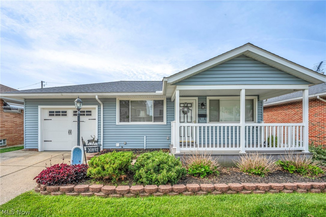 Welcome home to this lovingly maintained 3 bedroom, 2 full bath ranch, where warmth and pride of ownership are reflected inside and out. The charming covered front porch offers you an ideal spot to relax and enjoy a morning cup of coffee/tea.  Step inside to an open and light-filled living room featuring natural hardwood floors that flow seamlessly into your dining and kitchen area. Your bright and spacious kitchen boasts granite countertops and abundant cabinet space, perfect for preparing and sharing meals. You have plenty of room to entertain and relax in your finished lower level, complete with full bath, laundry & workbench area. Enjoy summer evenings, grilling and relaxing on your covered back patio! An oversized attached 1 car garage with plenty of storage completes this lovely home. Schedule your showing.....this is the one!