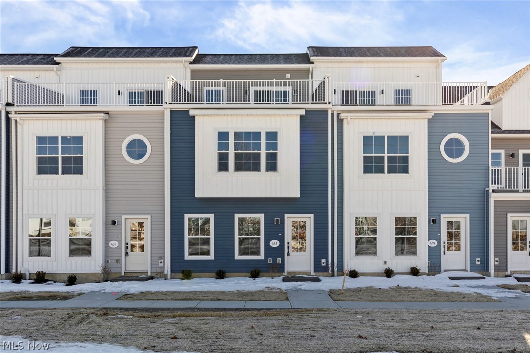 Welcome to Harborwalk. Lorain's Premier Waterfront Community! This brand-new, never-lived-in townhome offers 3 bedrooms, 2 full bathrooms, and 2 half bathrooms. The bright, open-concept main level features durable vinyl flooring throughout and a modern kitchen with quartz countertops, microwave, and dishwasher, all flowing seamlessly into the spacious living and dining areas filled with natural light. Upstairs, the primary suite includes a generous ensuite with a walk-in shower. Two additional bedrooms and a full three-piece bath complete the second level. Continue to the third floor to find a bonus living area with a wet bar, an ideal spot for entertaining or unwinding. Step out onto your private third-floor deck overlooking the river, offering front-row views of summer concerts and year-round events at Black River Landing. All of this is just steps from the Black River, Spitzer and Alliance Marinas, Lake Erie's scenic mile-long pier, and the vibrant Broadway District with restaurants, coffee shops, and the popular Lorain Brewing Company. The community includes a pool and fitness center.  The recently remodeled party center can also be rented for a fee. Waterfront living at its finest! Don't miss this incredible opportunity!
