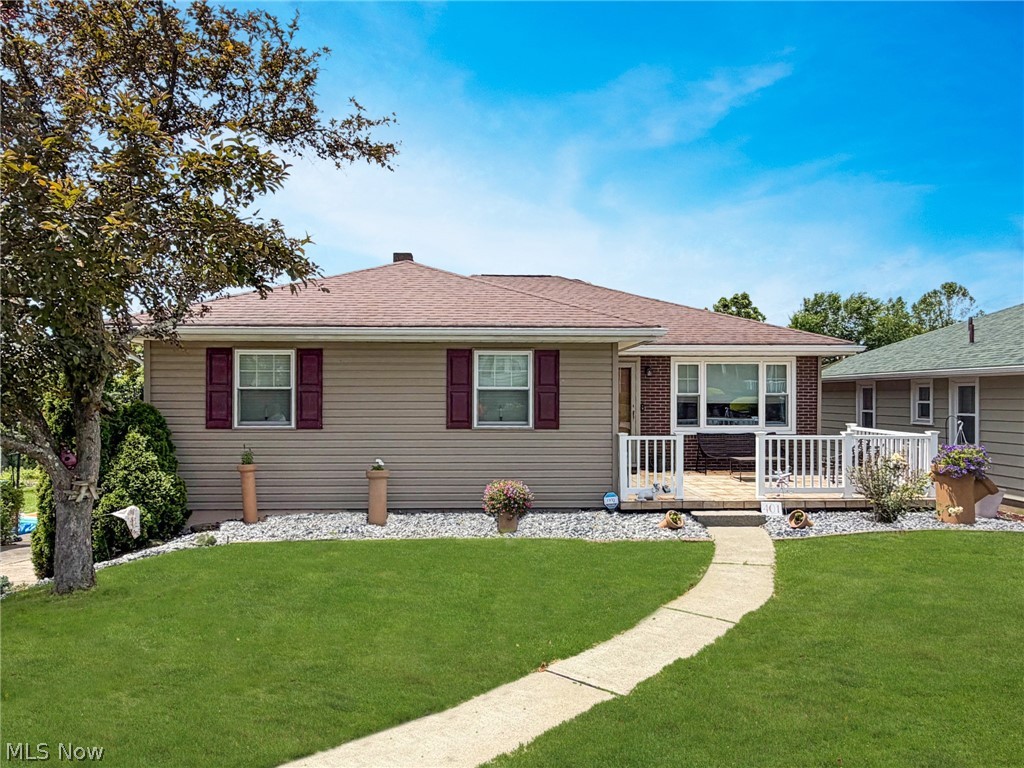 Welcome home to this beautifully maintained 3-bedroom, 2.5-bath brick ranch offering the perfect blend of comfort, updates, and outdoor living. From the moment you arrive, you'll appreciate the exceptional curb appeal, updated exterior, and inviting front porch.

Inside, you'll find a spacious living room filled with natural light, a stunning updated kitchen featuring granite countertops, a large center island, copper farmhouse sink, subway tile backsplash, and abundant cabinetry. The adjoining dining area creates an ideal space for both everyday living and entertaining. The primary bedroom includes a convenient private half bath, while the additional bedrooms offer comfortable accommodations for family or guests.

The finished lower level provides an expansive rec room with a fireplace, plenty of storage, and walk-out access to the backyard, creating additional living and entertaining space year-round.

Step outside and you'll discover one of the property's standout features—a massive covered deck directly off the kitchen overlooking a private, fully fenced backyard. Whether you're hosting gatherings around the custom firepit, relaxing in the hot tub beneath the newly installed gazebo, or simply enjoying the mature trees and open green space, this backyard was designed for making memories.

Major updates include: Kitchen (2019), Roof (2015), Front Door, Sliding Glass Door & Picture Window (2021), Hot Water Tank (2025), Electrical Updates (2025), Hot Tub (2019), Sauna (2022), and Gazebo (2025).

This move-in ready home offers the indoor space, outdoor amenities, and updates today's buyers are looking for. Schedule your private showing today!