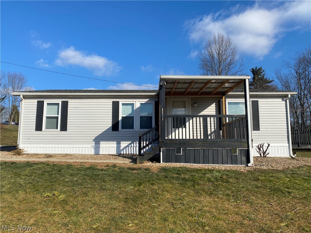 Here is a unique opportunity for peaceful living and multiple options! Just outside the city limits, this 3 bedroom, 2 bath home sits on a private lot, in a privately developed neighborhood. The home has new carpet through out and is currently having one of the bathrooms remodeled. Another potential perk is that the lot is set up to allow another home placed on it, including separate utilities possible and a separate address (510 S. Pleasant Grove Circle). This parcel could be used as-is for private residence, or put in the second home to share with extended family or investment purposes. 

Close to Route 40 with access to I-70, makes commute to various surrounding area quick and easy.