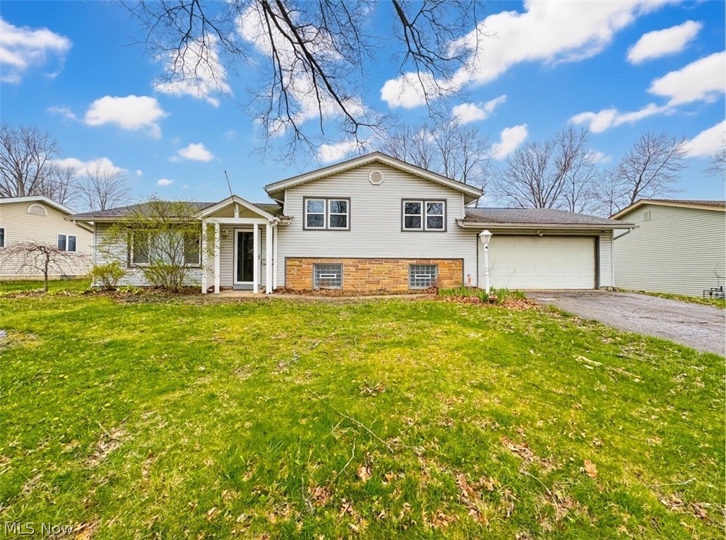 Welcome home to this beautiful 4-bedroom, 2 full bath split-level that delivers the perfect mix of space, upgrades, and lifestyle—inside and out. Offering over 1,700 square feet plus a finished lower level, this move-in ready home is ideal for buyers looking for flexibility and immediate enjoyment. The main level features a bright, open living and dining area with durable vinyl/LVT flooring and great natural light, flowing into a functional kitchen with included appliances and easy access to the backyard. Upstairs offers three spacious bedrooms and a full bath, while the lower level provides a large fourth bedroom or recreational space, second full bath, laundry area. Major updates including a newer furnace and central A/C add peace of mind, along with a heated attached 2-car garage for year-round convenience. Step outside and you’ll find the a ton of potential—a fully fenced backyard built for entertaining, complete with an in-ground pool, patio space, pool house, and storage shed, creating the ultimate setup for summer gatherings and relaxing weekends at home. Homes with this combination of updates, space, and backyard features are hard to find—don’t miss your chance to own it. Schedule your private showing today before it’s gone!
