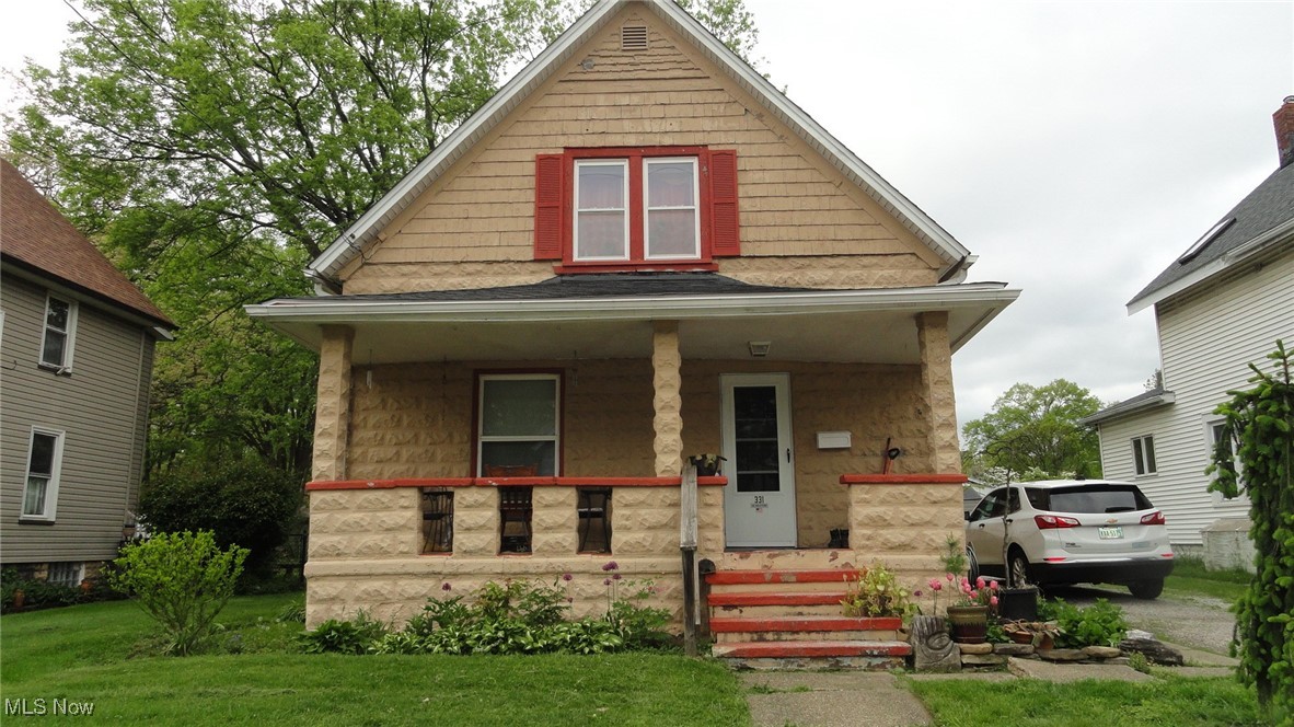 Here's a nice Cape in great condition situated on a lovely Cuyahoga Falls Street within close proximity to shopping, entertainment and the highway. This home has many charming features including the cozy front porch, foyer entry with open staircase and vintage woodwork and  hardwood floors from the foyer to the  living room and dining room. There's beautiful oak cabinets in the kitchen and a large mud room with extra cabinets for storage. Two bedrooms with plenty of closet space and a full bath upstairs and a 1/2 bath in the basement.  Updates include windows, electric panel, HVAC and a new roof in 2025! Plus there's a large fenced yard and a 12 x 12 shed with electric. Call today to see this lovely home.