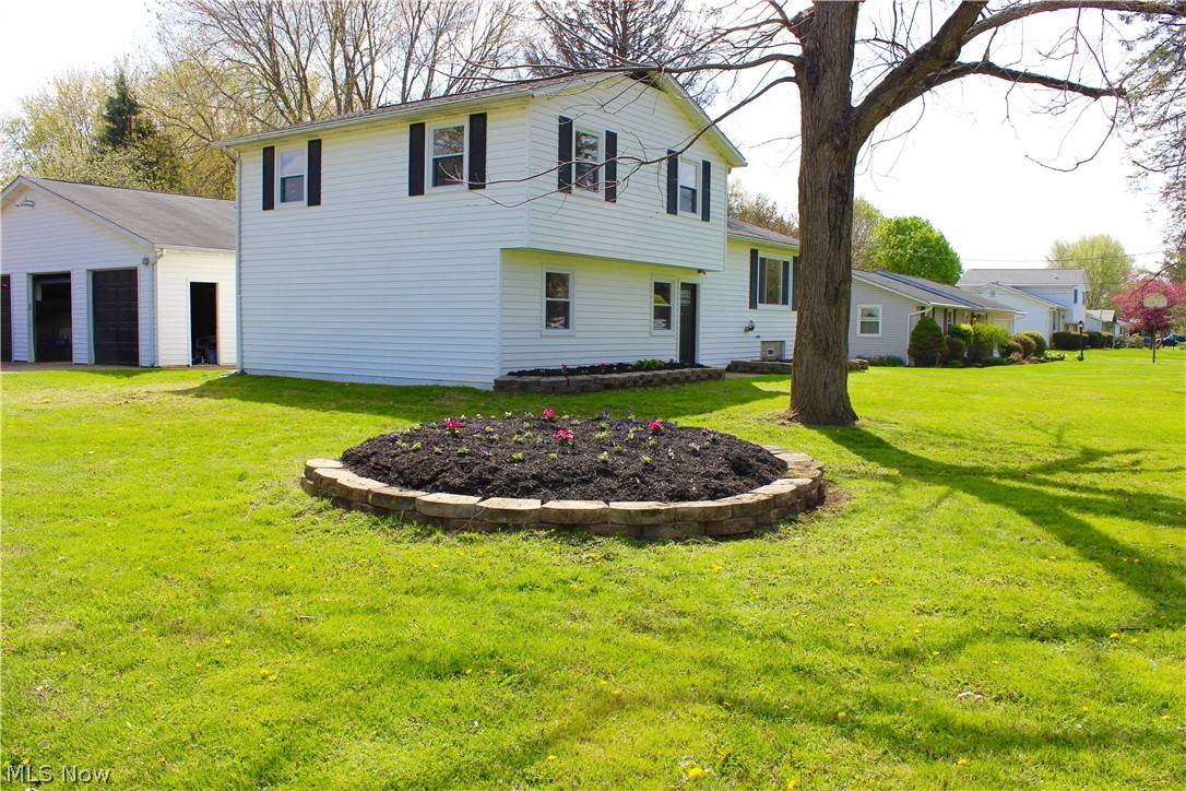 What a great value in Lake Township, North Canton Schools. Ready for summer enjoyment and entertaining with an in ground pool, new covered deck and new privacy fence. The 3.5 car garage serves also as pool side entertaining with garage door access to the pool area. This 4 level split features a completely renovated interior including a new kitchen with center island, a new main bath with access from Master bedroom, all new flooring, paint and lighting. New windows 2021, new roof in 2014, new furnace 2017 and central air will be installed prior to closing. The in ground pool had a new liner in 2010 and then the pool has been closed since 2013. Visually inspected and pump tested by current owners 2021. An unconventional open floor plan split level ready for you to make it your home.