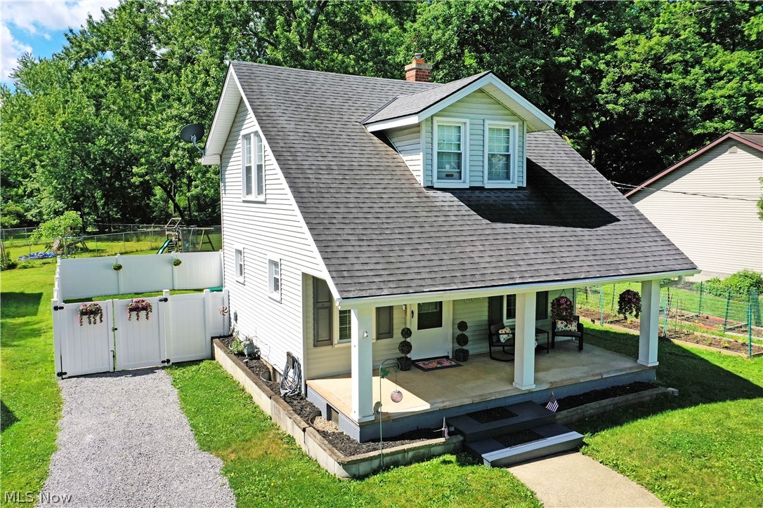 Historic charm meets modern updates in this beautiful bungalow in the heart of Poland Village! Welcome to 23 Massachusetts Ave! A large, covered front porch welcomes you home and also provides the perfect spot for a morning coffee or evening beverage. Step inside the updated living room with low maintenance wood look flooring, awash in natural light. Steps away, the formal dining room provides the perfect place for gathering around the table with a convenient pass thru from the kitchen for serving meals. The kitchen has plenty of counter space for prep and painted wood cabinetry for all your storage needs. An ample first floor bedroom (currently used as a den) and an updated powder bath complete the first floor. Upstairs you will find 2 large bedrooms joining an updated full bath complete with a tiled shower surround. Outside, enjoy a private concrete patio inside a fenced in portion of the yard perfect for pets or little ones. The yard continues beyond the fence meeting up with an incredible public walking path that winds through the neighborhood. The lower level of the home plays host to laundry services, storage space and mechanicals. Many of the large items are newer including the roof, water heater, windows, electrical, interior and exterior doors, and paint. What are you waiting for? Call today for your personal tour!