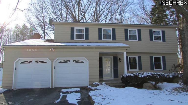 Welcome home to this secluded Colonial on a cul-de-sac. This spacious home is private, although close to the buzz of downtown Kent as well as Kent State University. Beautiful yard and lot, the home has updated appliances, new windows 2012, 4 bedroom 2.5 baths, with a master suite, attached 2 car garage and shed. Hardwood floors in bedrooms, and finished basement with additional recreation room and office.  This home has an out in the country feel, with the convenience of being near all the happenings of Kent, and is less than 2 minutes to Interstate 76. This home is well cared for and a great value! Definitely worth a look! Home warranty is being offered through Old Republic as well!