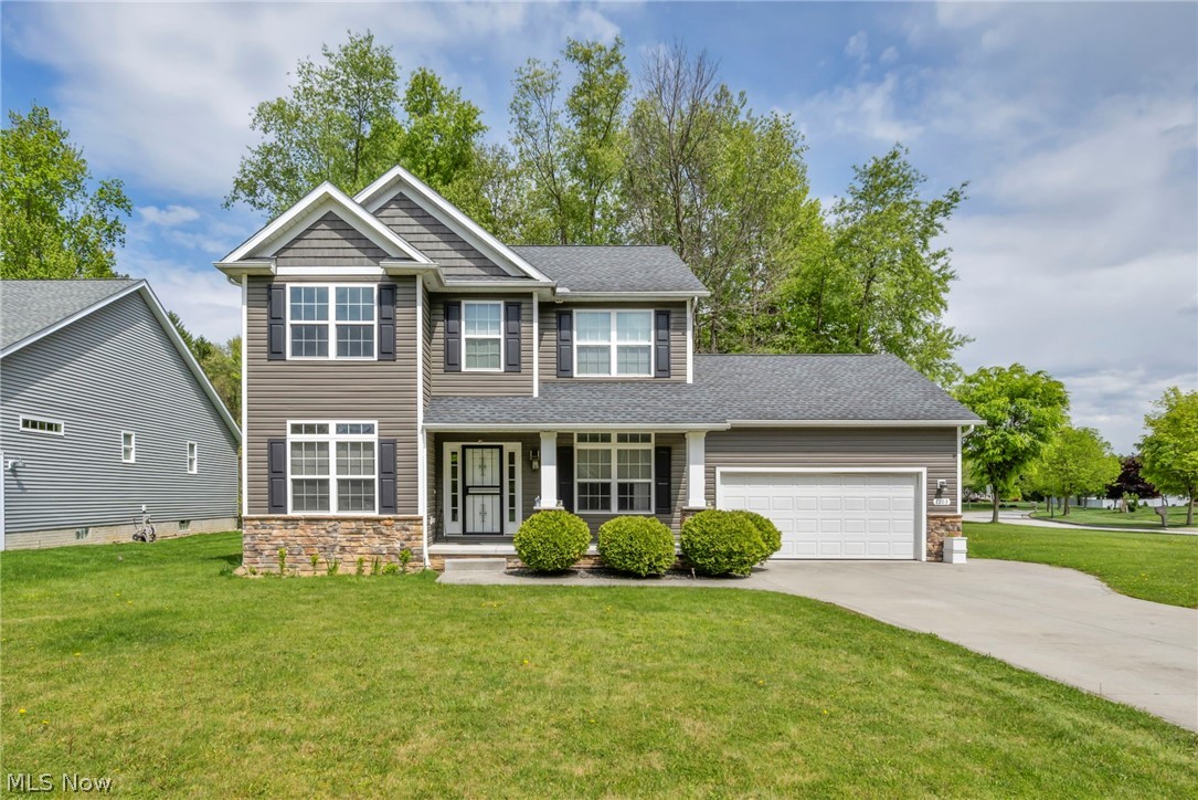 This move-in ready home offers the feel of new construction with thoughtful upgrades already in place. Nestled in a charming sidewalk-lined community close to parks, dining, and shopping, this home combines comfort, convenience, and style.
The inviting covered front porch welcomes guests and offers the perfect spot to relax while overlooking the corner lot. Inside, the foyer features durable engineered wood flooring and a convenient coat closet. Just off the entry, a dedicated first-floor office provides flexible space for working from home, studying, or managing day-to-day life. The heart of the home is the open living area, where the spacious great room with fireplace flows seamlessly into the kitchen and vaulted morning room. The kitchen is equipped with granite countertops, a large center island, stainless steel appliances, and plenty of room for gathering and entertaining. A door off the morning room leads directly to the backyard. Upstairs, the primary suite offers a spacious retreat with a private bath featuring both a soaking tub and separate shower. Two additional bedrooms share a full bathroom.
The finished lower level adds even more living space, complete with an additional half bath; ideal for entertaining, movie nights, or relaxing. There’s also ample unfinished storage space to keep everything organized. Outside, the yard offers enough room for a future patio or deck while backing to wooded views for added privacy and easy maintenance. Why start from scratch when this home already has it all? Schedule your private showing today!