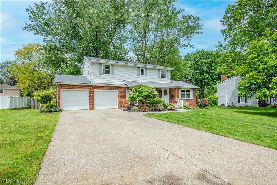 Welcome home to this beautifully maintained 4 bedroom, 2.5 bath colonial located in a desirable Wadsworth neighborhood close to schools, shopping, dining, and highway access. Step inside to a welcoming foyer with hardwood flooring that opens to a spacious and functional layout perfect for everyday living and entertaining. The front living room features newer carpet, while the expansive family room offers hardwood floors, a stunning bay window, built-in shelving, and a cozy gas fireplace with an oversized hearth. Sliding glass doors lead to a peaceful backyard retreat featuring a large freshly painted deck shaded by mature maple trees, perfect for entertaining or enjoying your morning coffee. A gas line is already in place for your grill, and a charming pond with a water feature adds to the relaxing atmosphere. The bright kitchen features white cabinetry, double ovens, a spacious peninsula with a glass cooktop and seating for four, plus plenty of prep space. Just off the kitchen is an oversized laundry room with extra cabinetry, pantry storage, a built-in desk area, and direct access to both the deck and oversized 2-car garage with high ceilings and abundant storage. The formal dining room showcases beautiful original hardwood flooring, while an updated half bath completes the main level. Upstairs you'll find brand new carpeting throughout all four bedrooms, including a spacious primary suite with a remodeled en suite bath featuring a walk-in tiled shower and ceramic flooring. A second updated full bath offers double sinks and a tub/shower combination. The professionally waterproofed basement provides endless possibilities for additional living space, recreation, or entertaining, with plumbing already in place for a future bar sink. Lovingly cared for by only its second owner, this home is truly a rare opportunity.