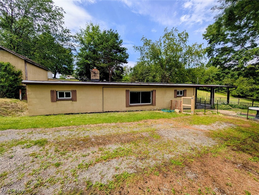 This versatile residential/commercial property offers the perfect combination of comfortable living, income potential,
and business opportunity all in one. This home features 2 bedrooms and 1.5 bathrooms, with a spacious addition that
creates a large living room area and a separate flex space/office/storage room. Off the backside of the house is an
enclosed walkway that leads to a well-kept storage shed that opens into a completely fenced-in area perfect for
animals. Business owners and mechanics will love the oversized 3-car garage, formerly operated as an auto repair
shop and used-car dealership. The building includes a lobby/office, a large storage room, and ample workspace. In
addition, there is an apartment above the office area of the garage, currently tenant-occupied; this offers immediate
and future income. This property also features a large open area with excellent road frontage and an additional shed.
This area was previously used as the car sales lot and office, providing great visibility and flexibility for commercial
ventures.